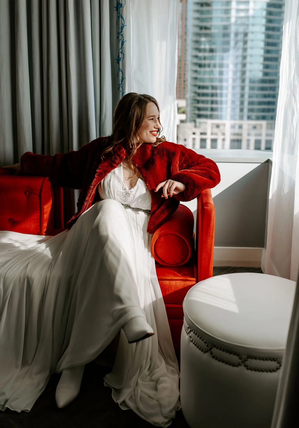 Candid bridal portrait taken in a modern Seattle hotel suite before a wedding ceremony