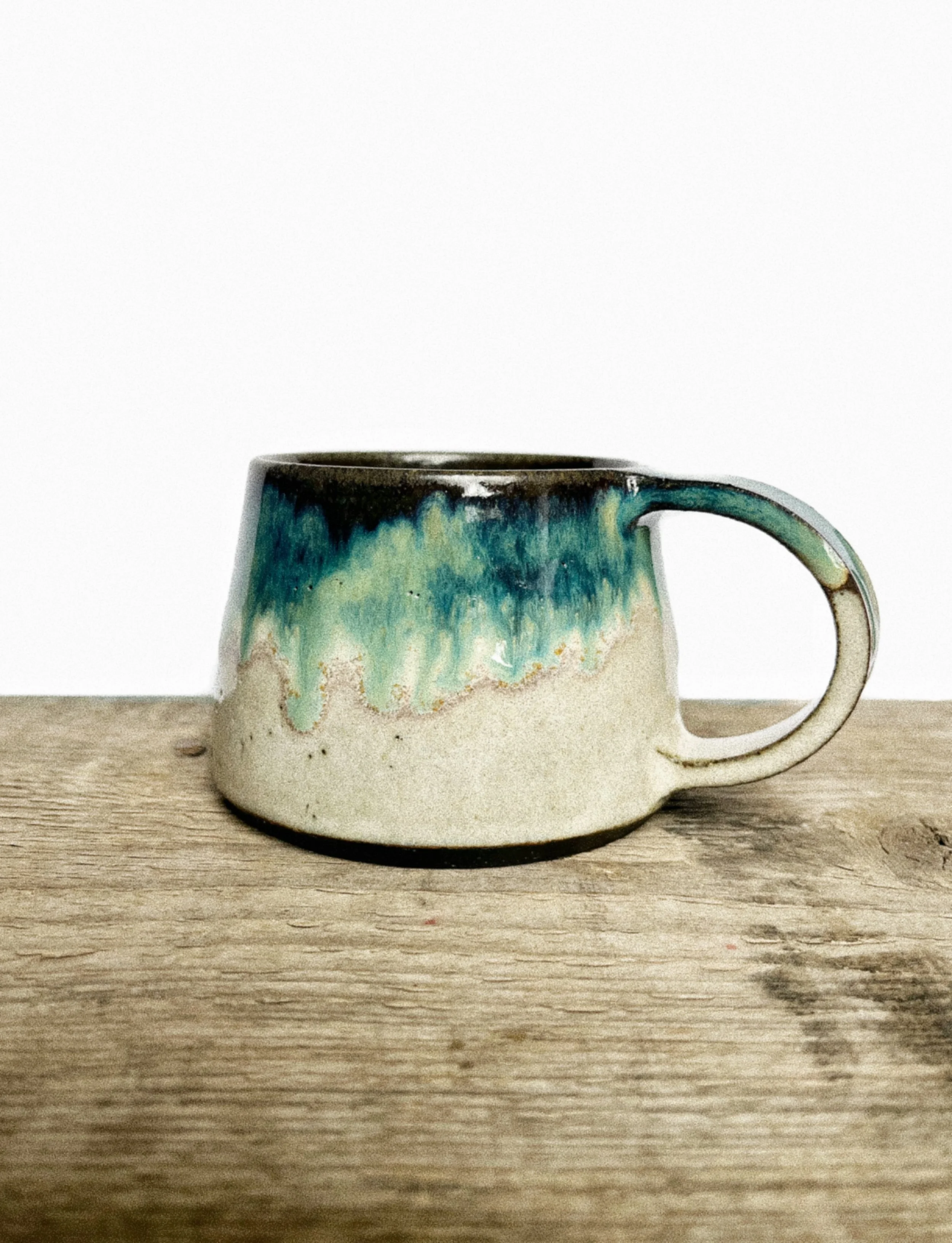 Tapered mug in Oribe