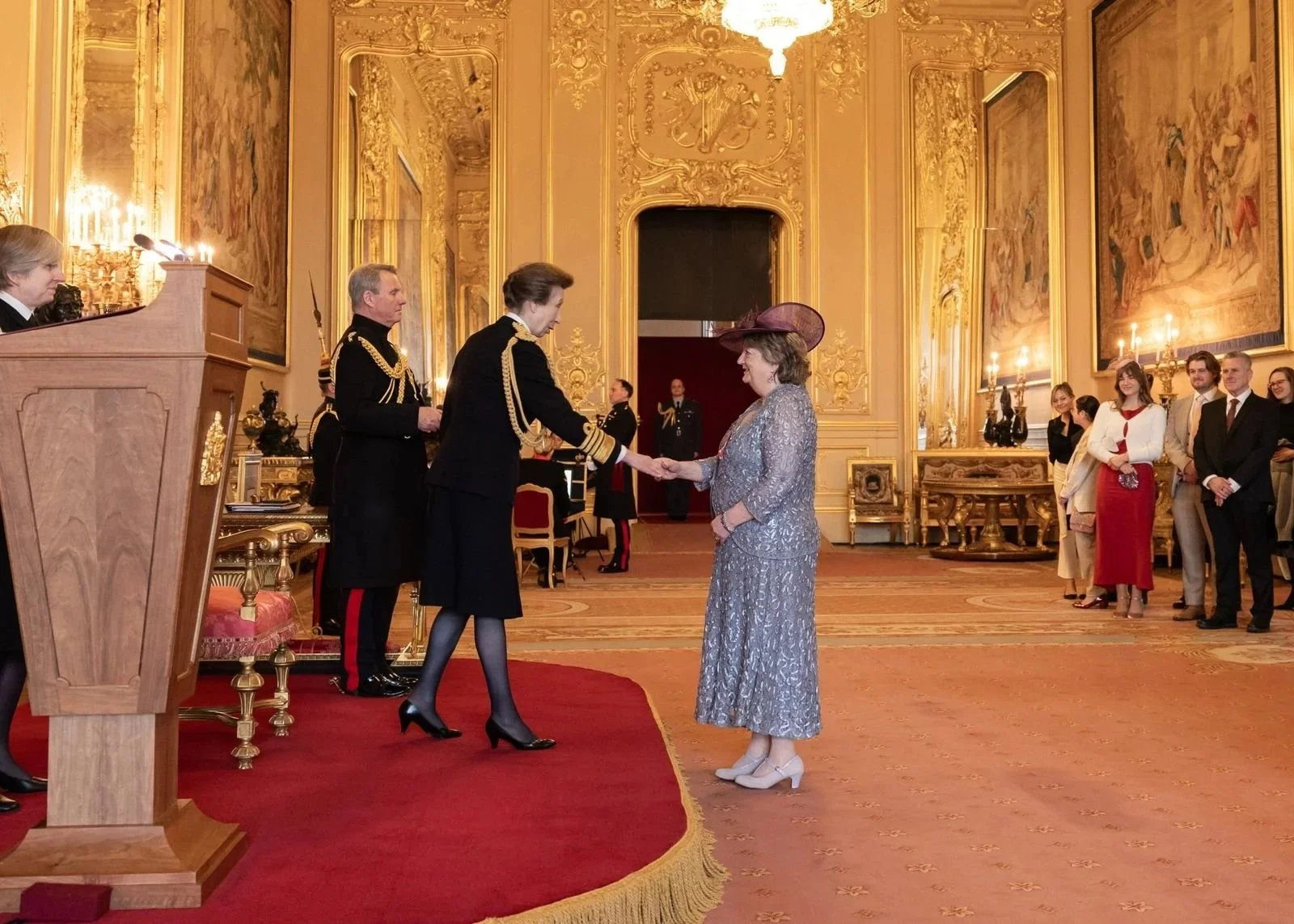 Jacquie Neilson MBE receiving her award from HRH Princess Anne at Windsor Castle, 2024