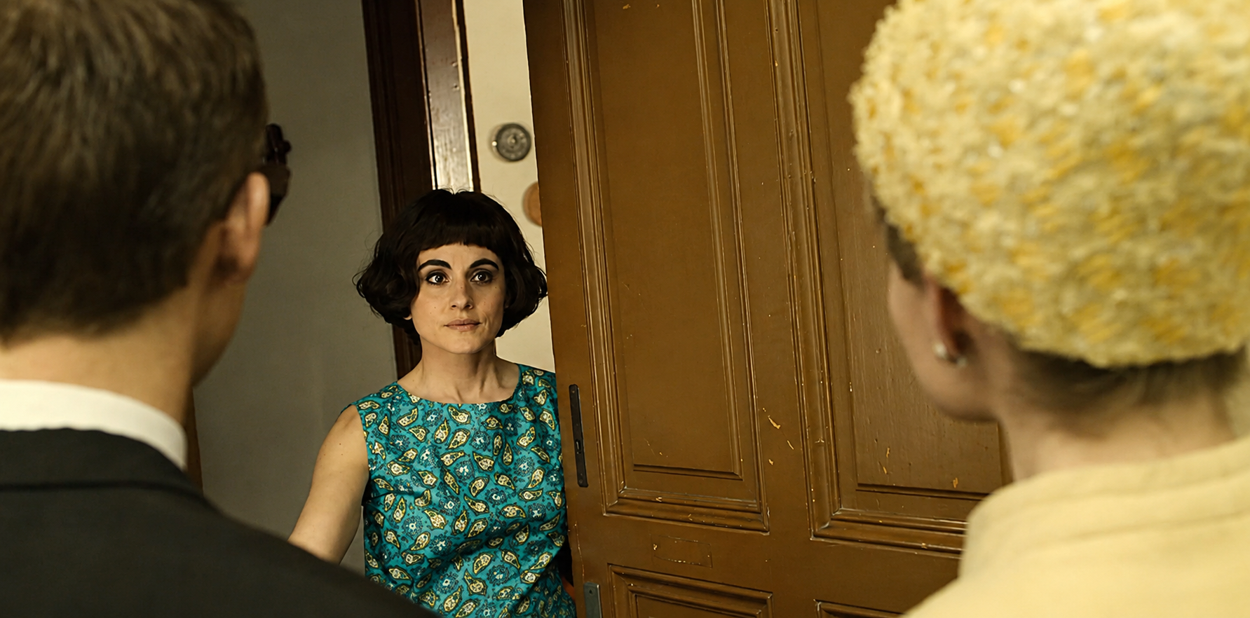 Shireen Farkhoy in a scene with Joe Cole and Lucy Boynton from ITV drama The Ipcress File.