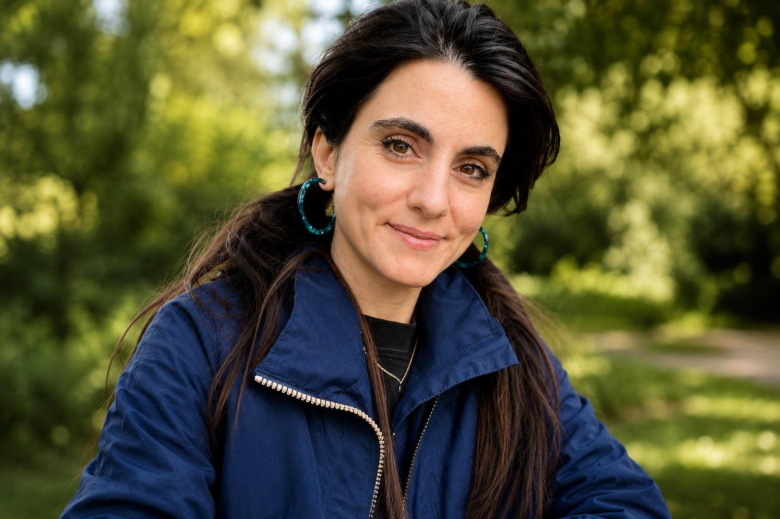 Portrait of British-Iranian actor, role-play specialist and acting coach Shireen Farkhoy outdoors in London.