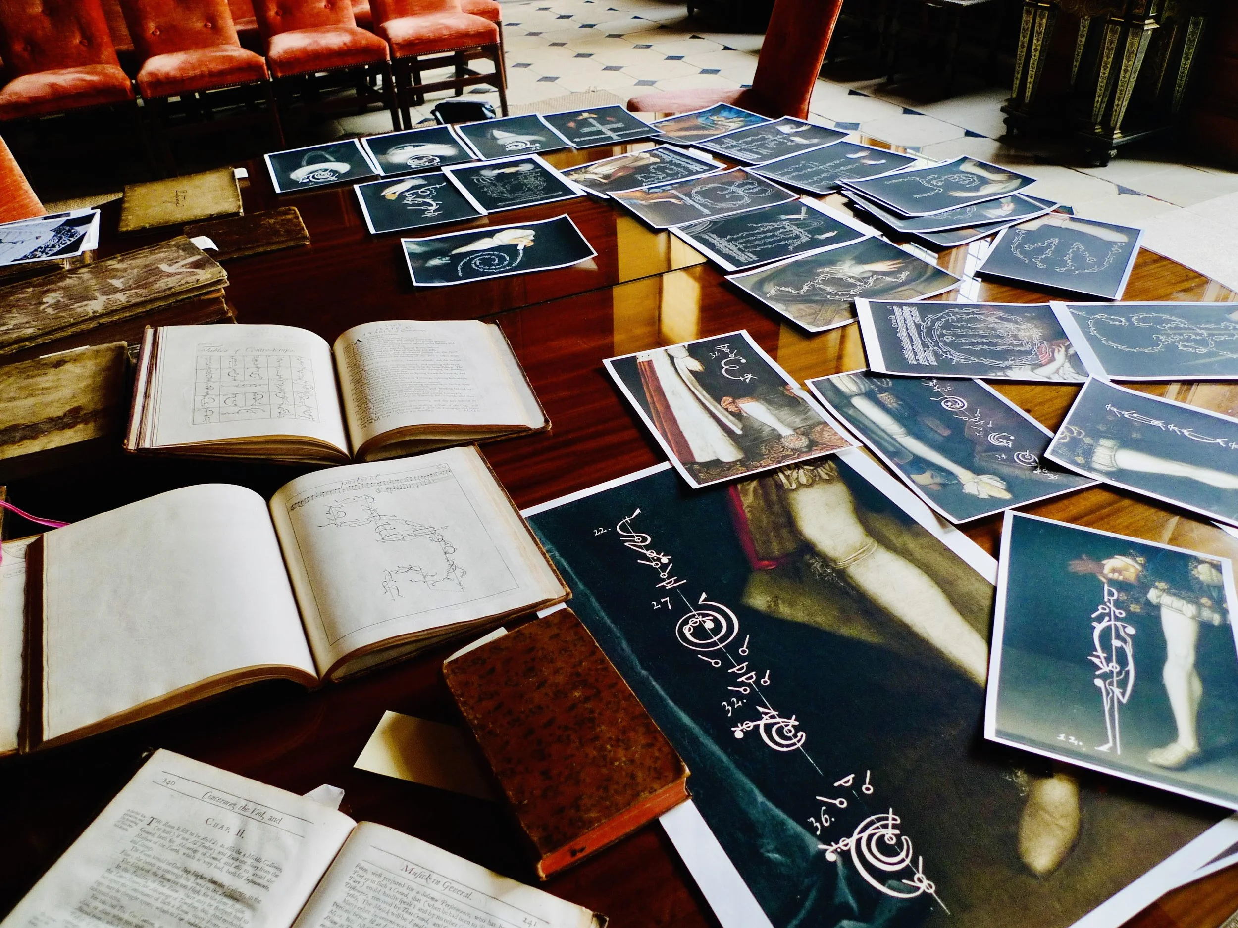In 2014, merging the musical with the visual, the eminent photographer Tessa Traeger brilliantly married family portraits with elements of 17th century dance notation. Here the original dance books are laid out with some trial prints ahead of her 201
