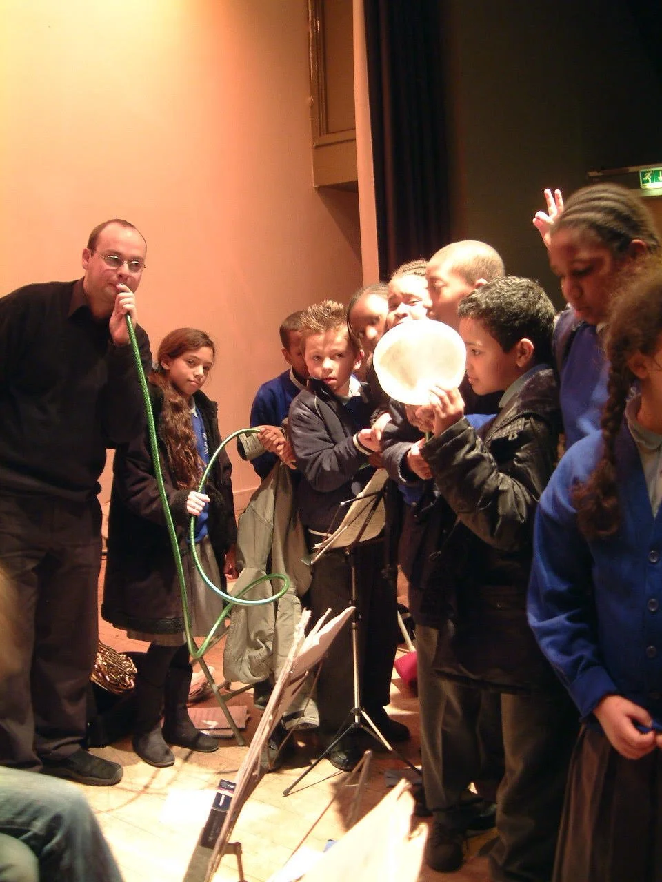 The principle of the horn demonstrated with a hosepipe and a kitchen funnel.