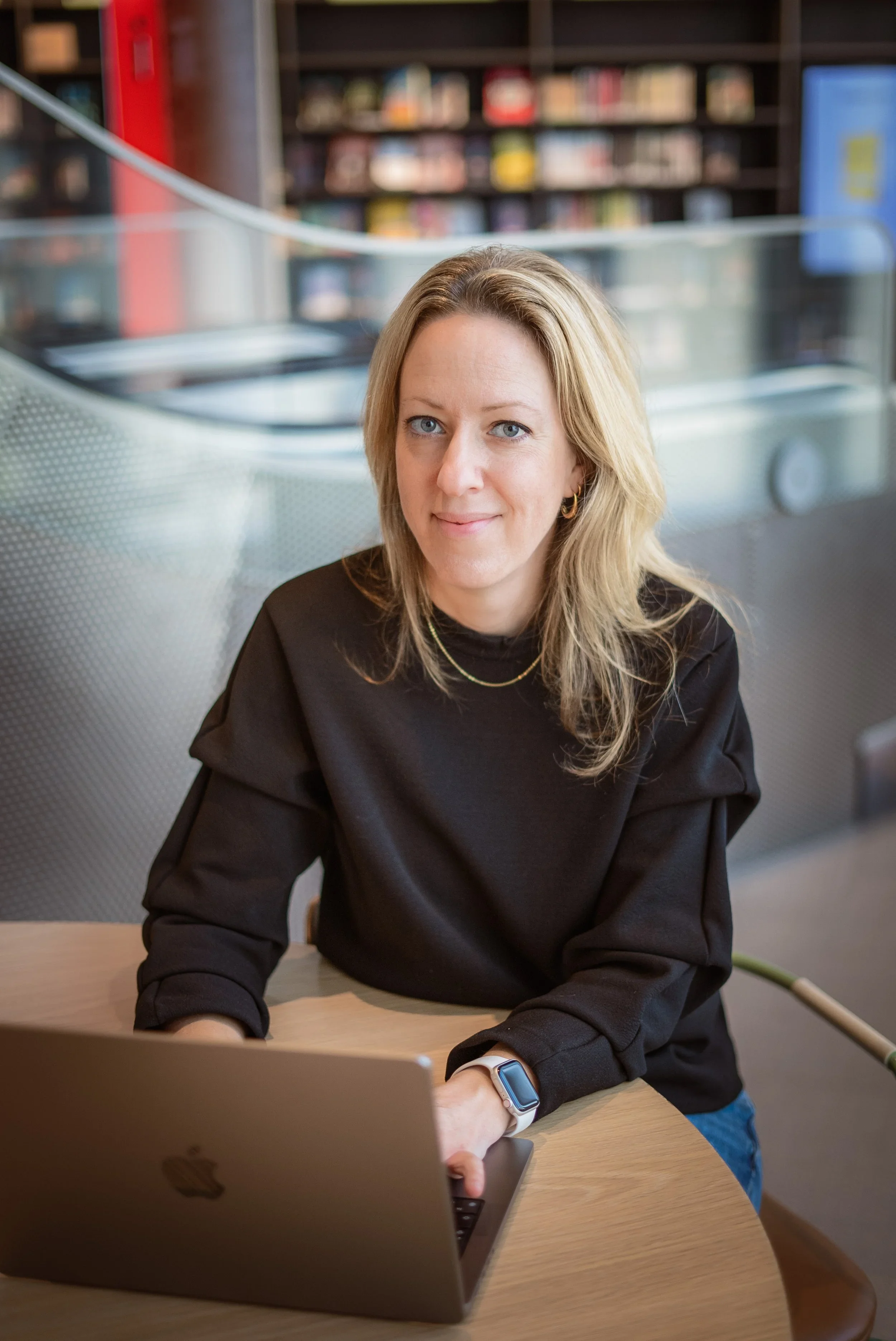 Light haired woman in black jumper looking at the camera; Lisa Ekli