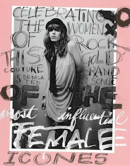 Black-and-white photograph of a woman with wavy hair, wearing a loose dress and a tie, against a pink background. Overlaid with handwritten text celebrating women in rock music, mentioning couture, the brand, and feminine icons.