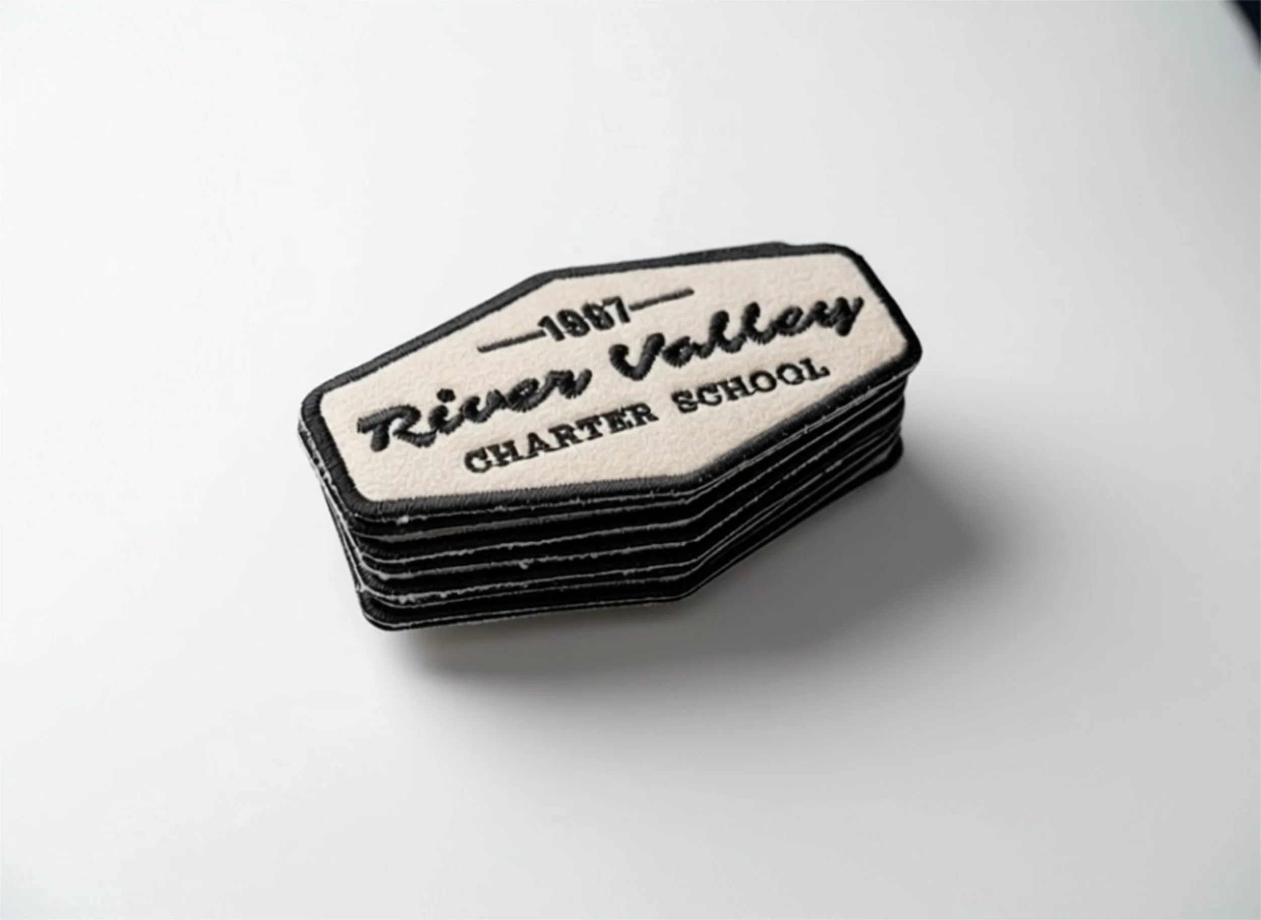 Stack of embroidered patches with text '1967 Trier Valley CLARIFIER SCHOOL' on a white background.