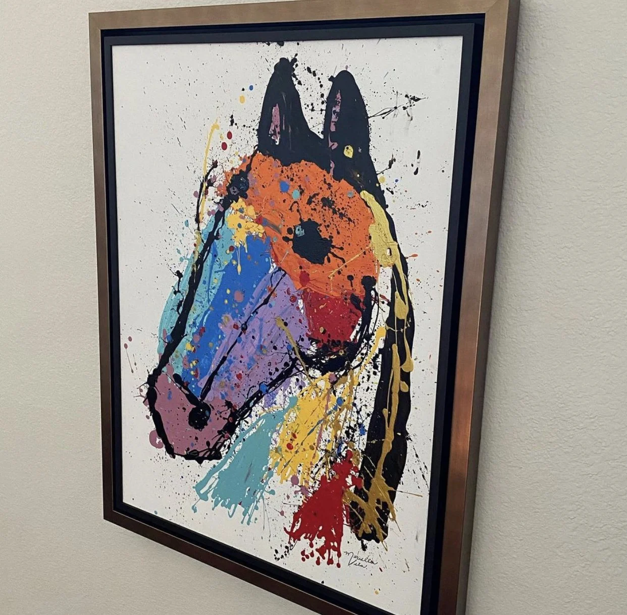 Colorful abstract painting of a dog, with splashes of bright colors like orange, blue, yellow, and red, on a white background.