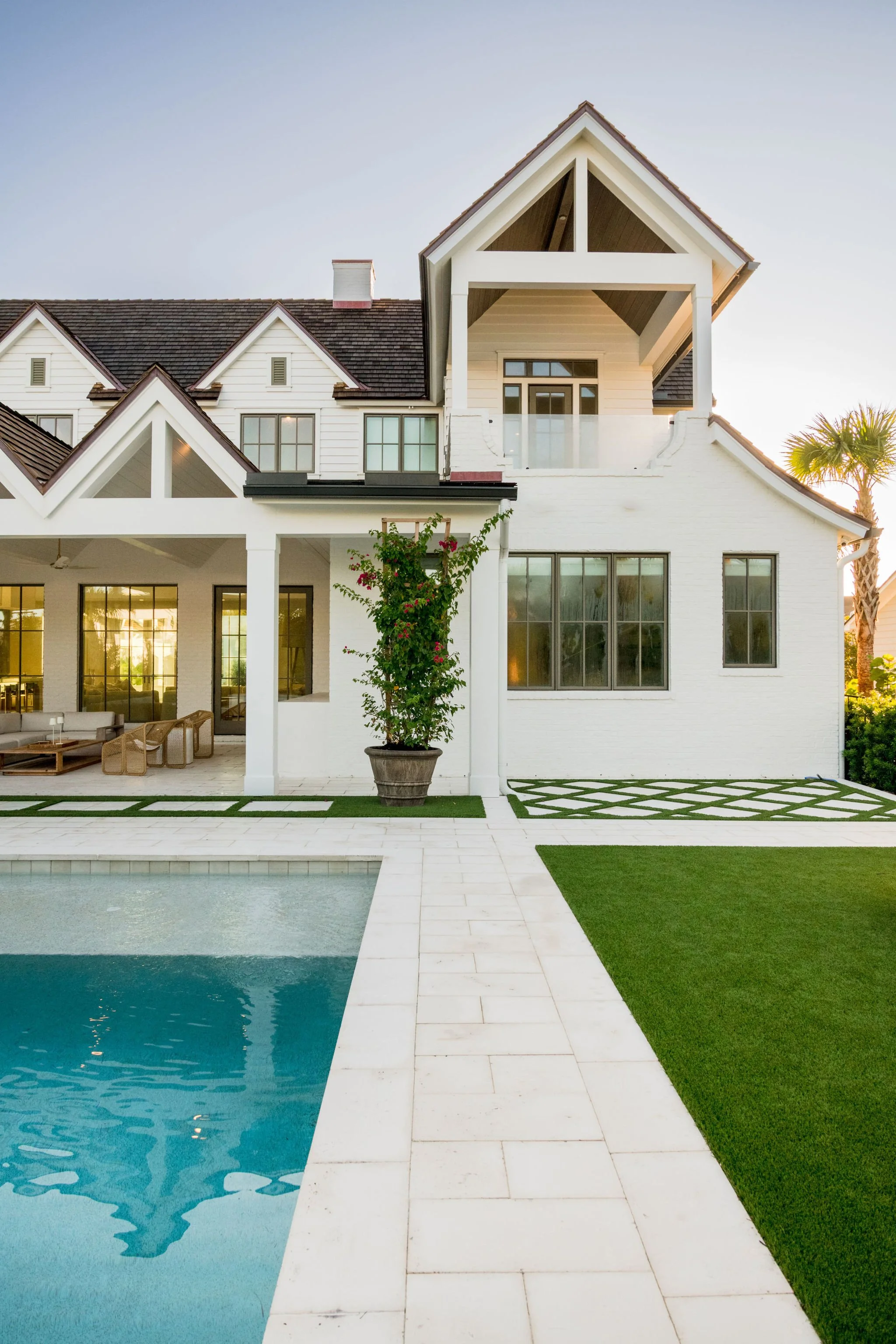 Luxury coastal pool  with decorative pool deck and bougainvillea at Bellecôte in Ponte Vedra Beach, Florida.