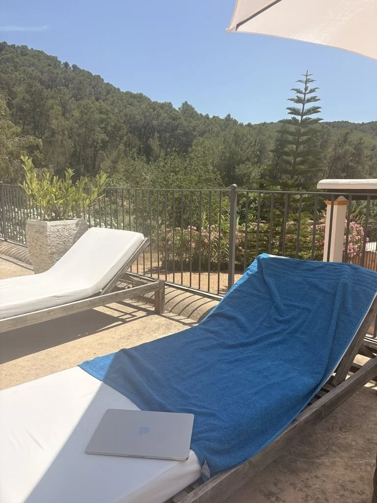 Poolside loungers overlooking the pine woodland at our Ibiza villa