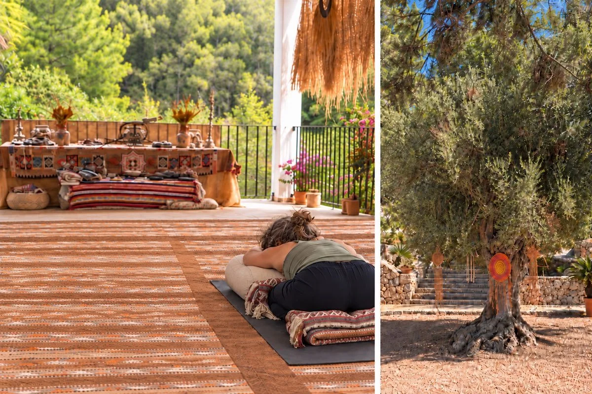 Illustrative scene of a woman resting in supported child’s pose on an open-air yoga terrace, alongside a shaded retreat garden.