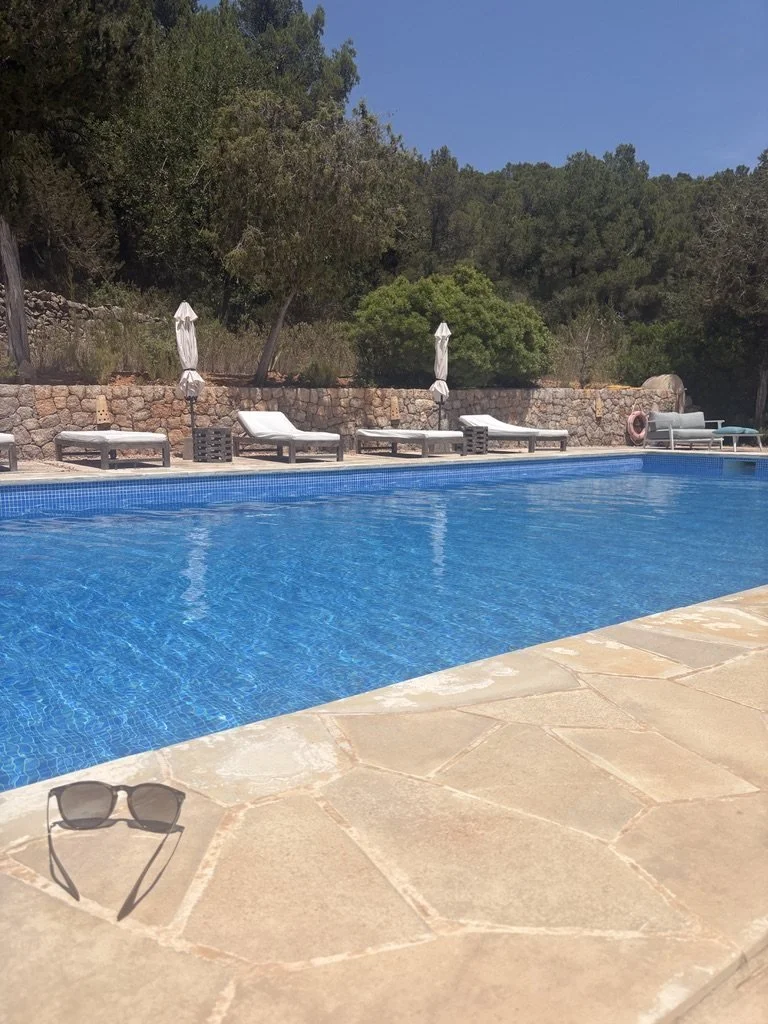 The shared villa swimming pool and terrace. This shows the communal setting, not the casita interior.