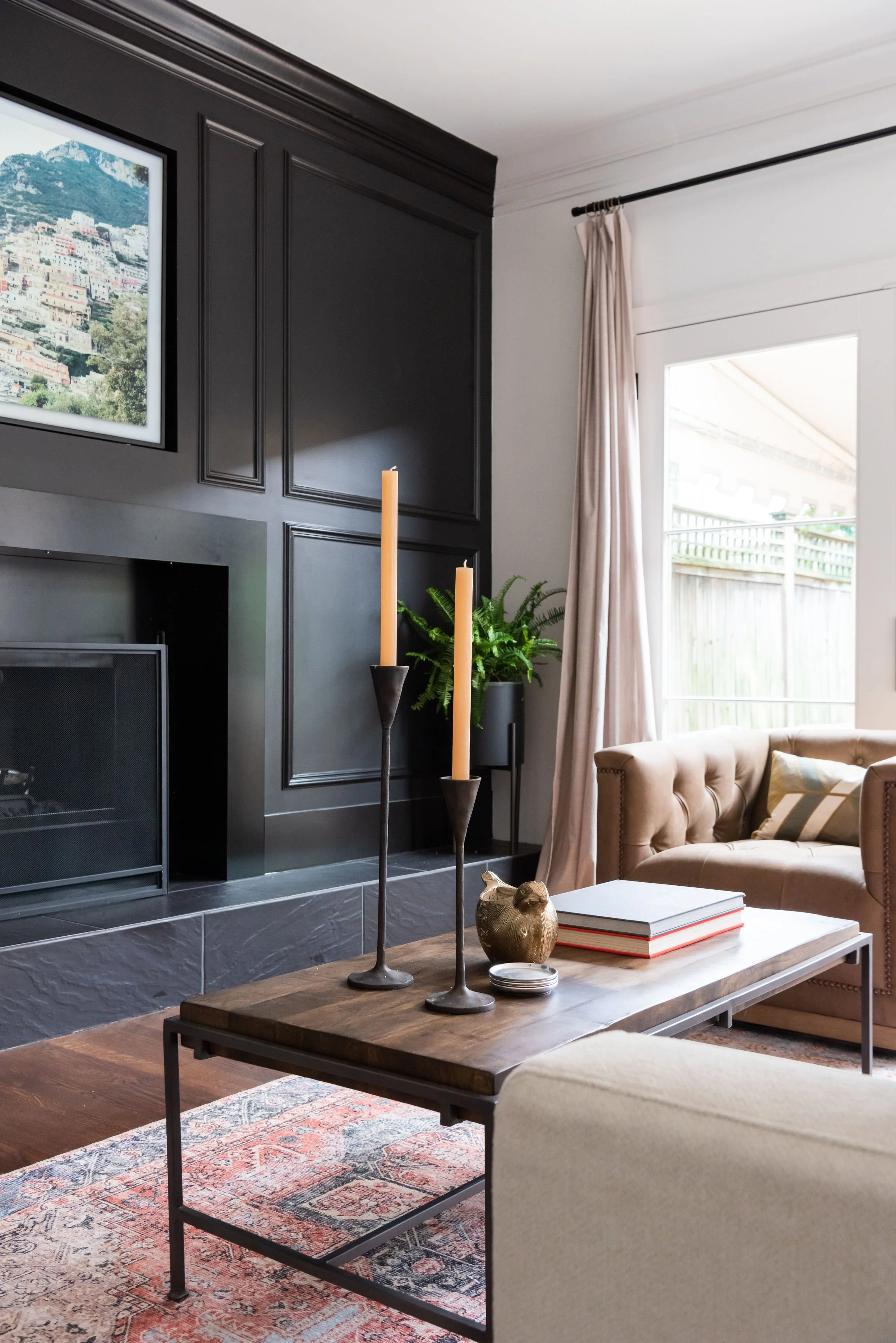 Living room with dark accent wall and fireplace, custom home Nashville.