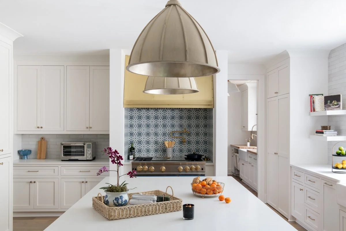 Bright, white kitchen with blue tile backsplash in a Nashville custom home.