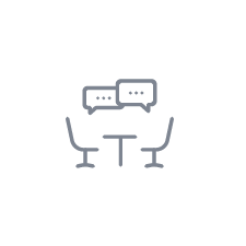 Consultation icon: table, chairs, and speech bubbles.