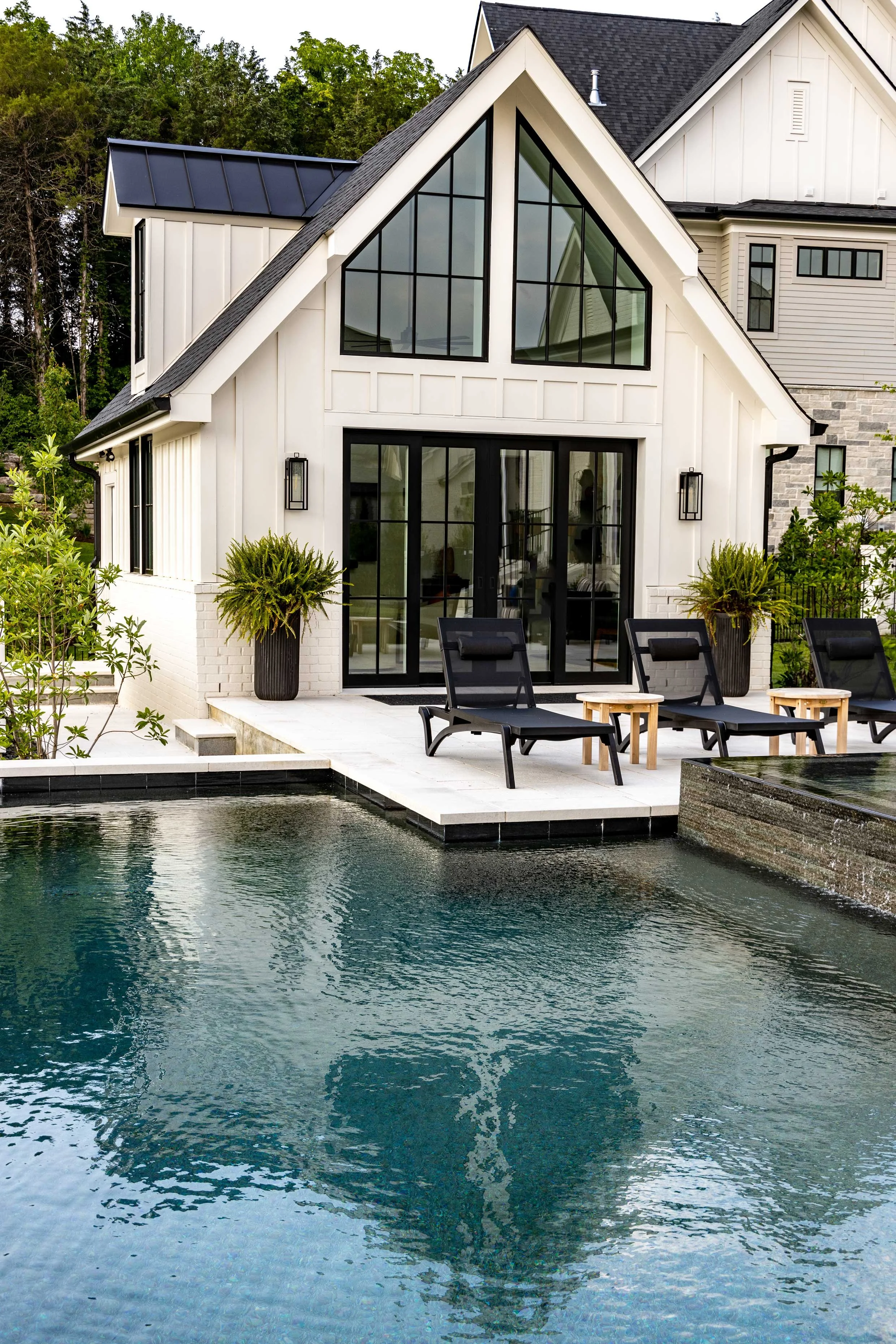 Luxury custom home Nashville with pool and modern farmhouse style architecture.