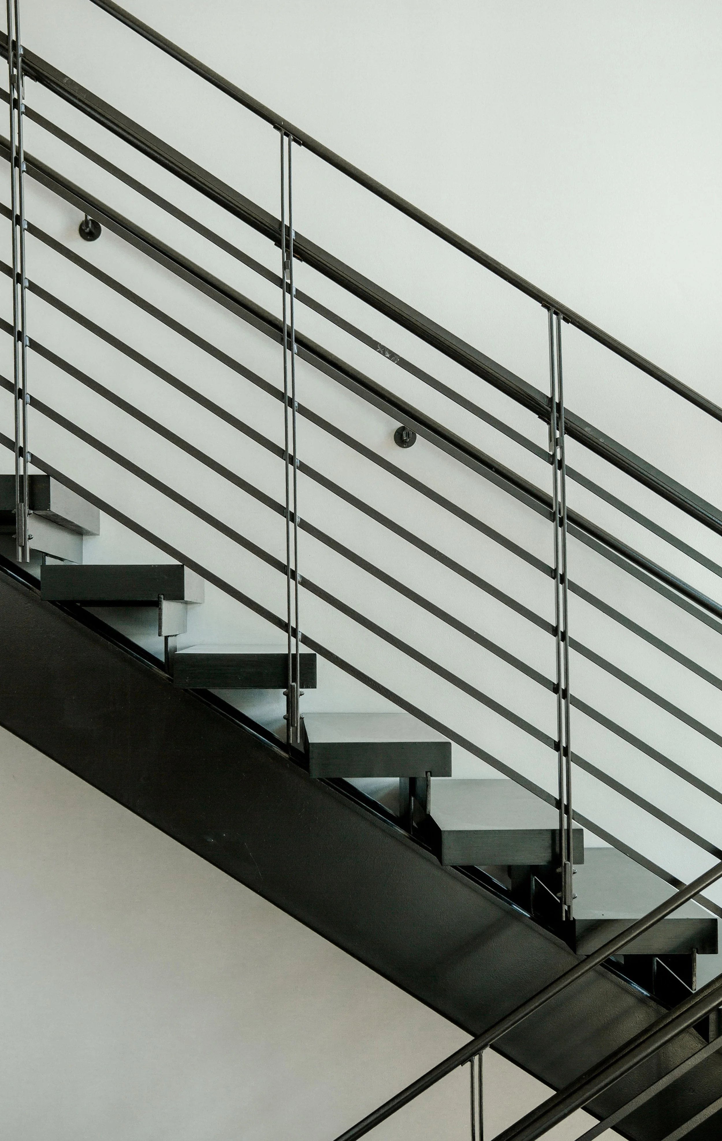 Modern staircase with metal railing in a custom home in Nashville.