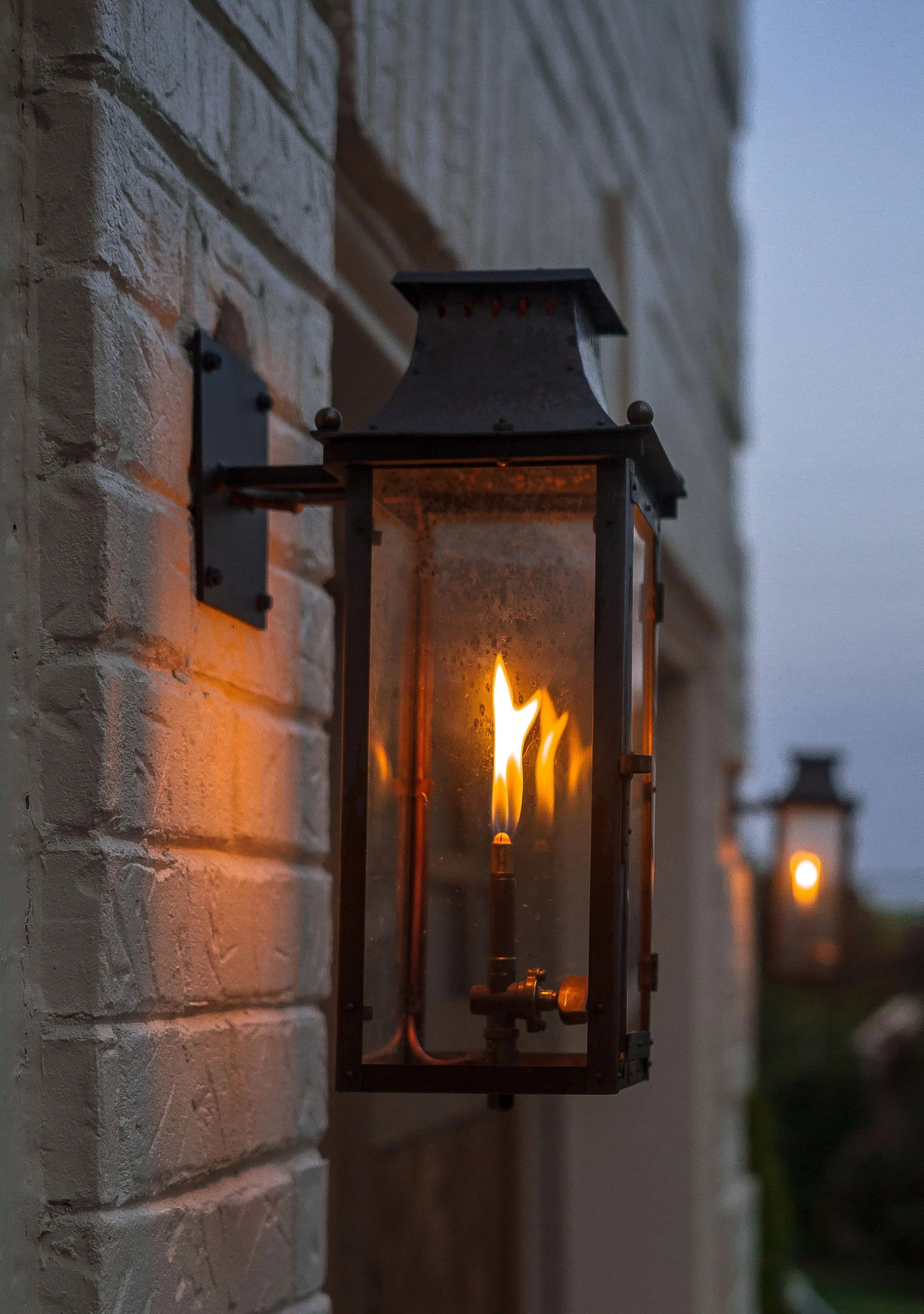 Gas lantern on a brick wall. Custom home Nashville detail, lighting fixture.