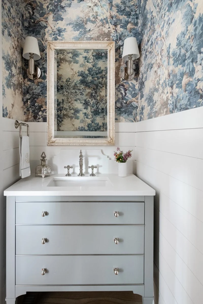 Powder room with blue toile wallpaper built by a luxury home builder in Nashville, TN.