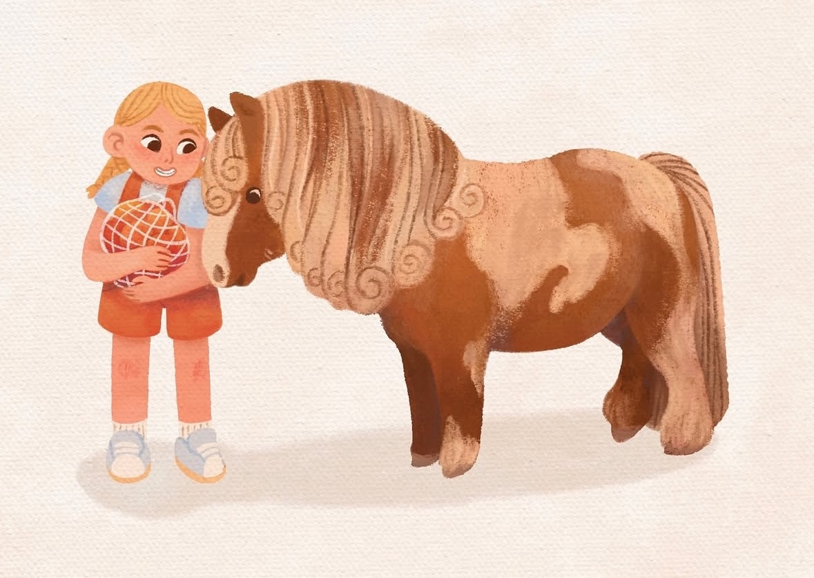 A girl with blonde hair, wearing a blue shirt, orange overalls, and sneakers, holding a red ball and smiling next to a small, brown, illustrated horse with a curly mane.