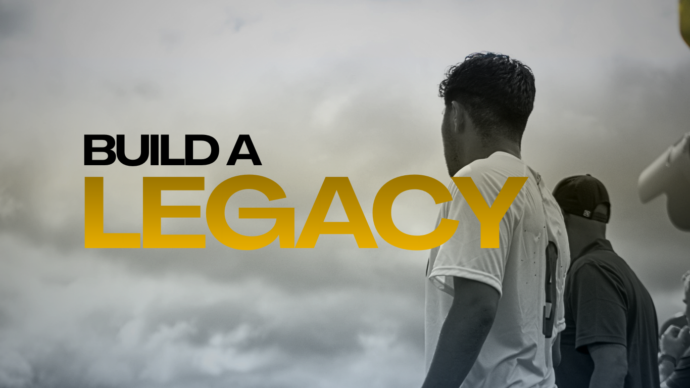 Athletes standing outdoors under a cloudy sky, with the phrase "Build a Legacy" overlayed in bold black and gold text.