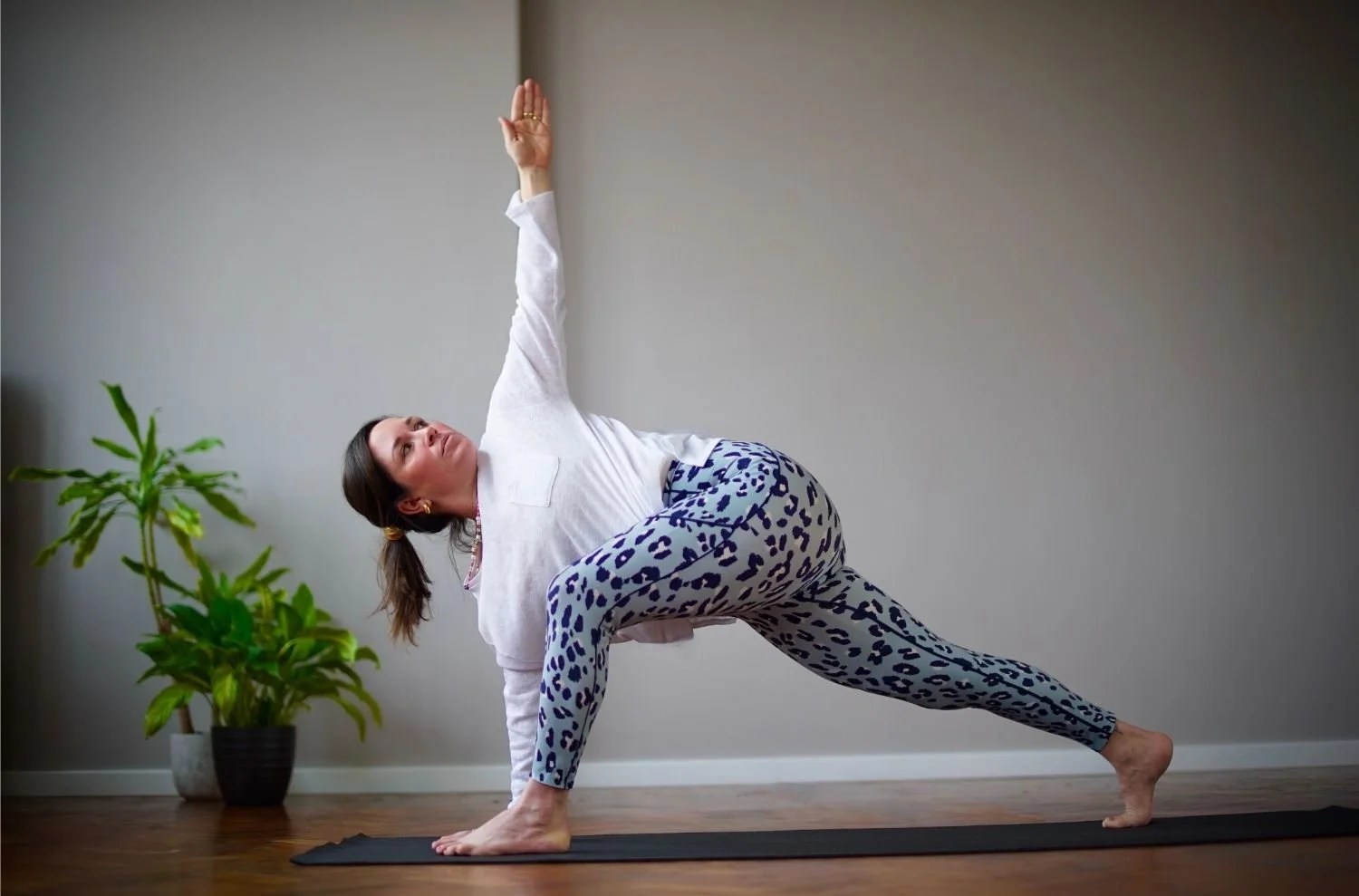 Lisa Lawton performing an intentional yoga flow in West London, demonstrating the nourishing movement taught in her private and group classes.