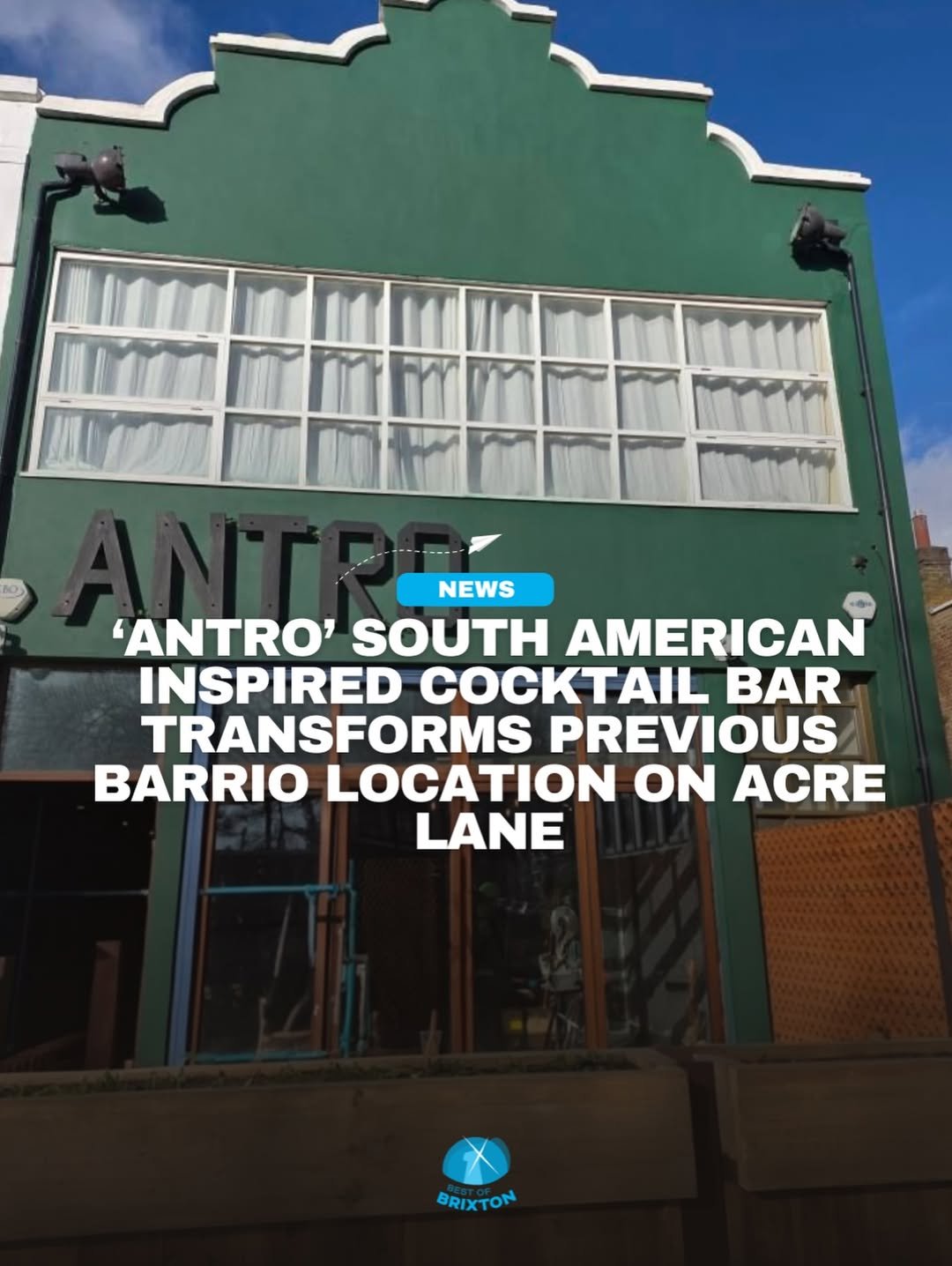 Exterior of a green building with large windows and a black sign that reads 'ANTRO'. White curtains are visible through the windows. There are two black outdoor lights on either side of the building. A headline about a South American-inspired cocktail bar named 'ANTRO' transforming a previous barrio location on Acre Lane is overlaid on the image, with a small blue label reading 'NEWS' and a logo at the bottom that says 'Best of Brixton'.