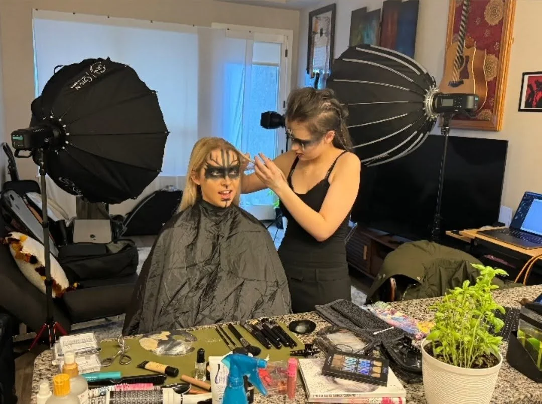 A model, Addi, wearing hand-painting and airbush runes designed to look like a viking.