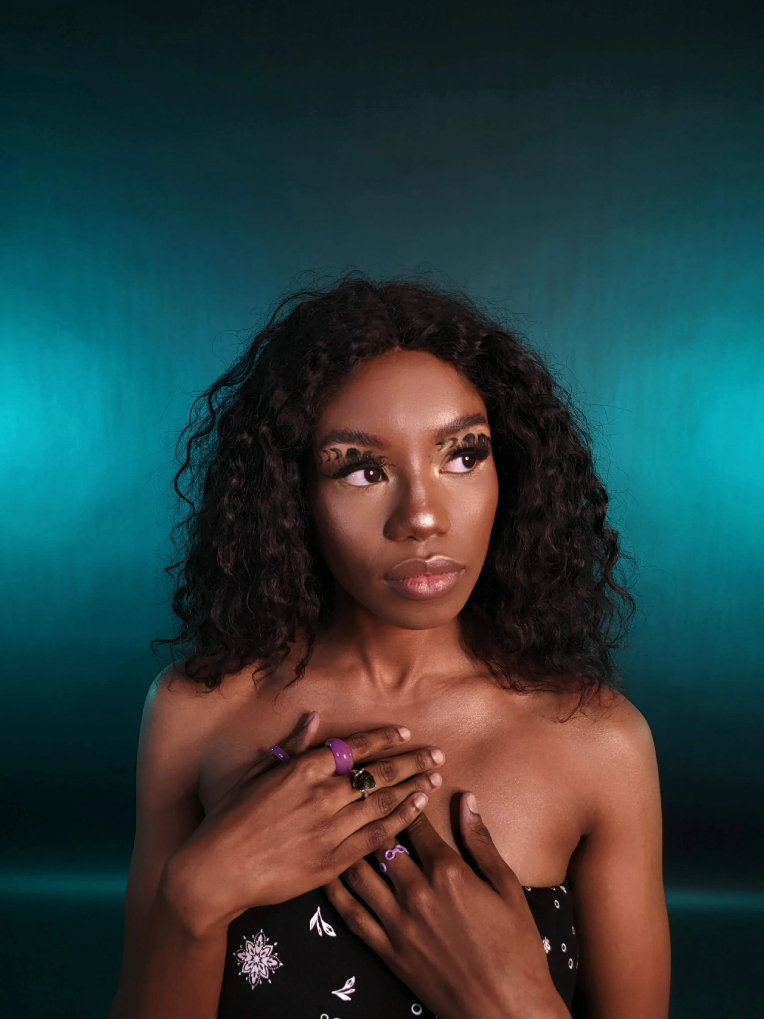 A close-up of a specialized foundation application on deep skin tones, highlighting color-matching precision.