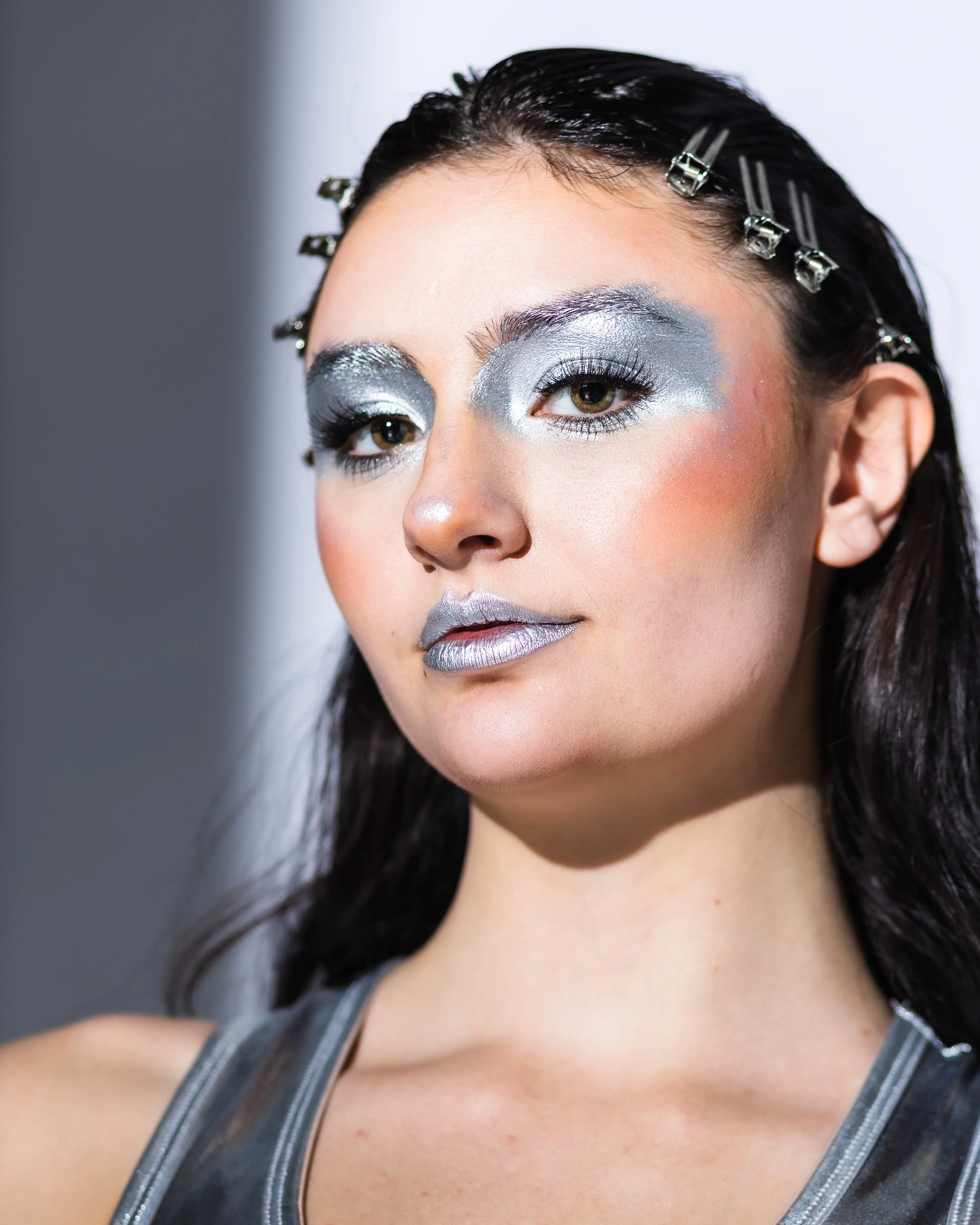 A professional portrait of model, Kristina,  where the makeup is specifically contoured to catch dramatic photographic lighting.