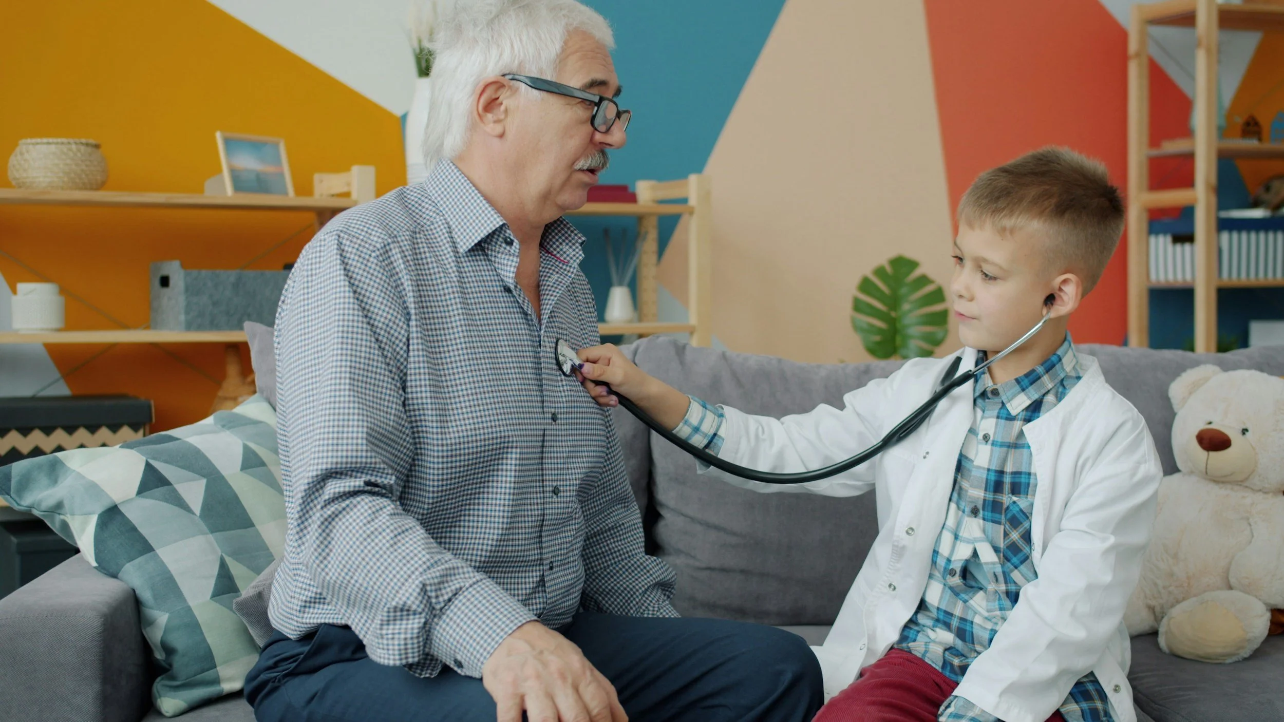 Child listening to Pediatrician's heart