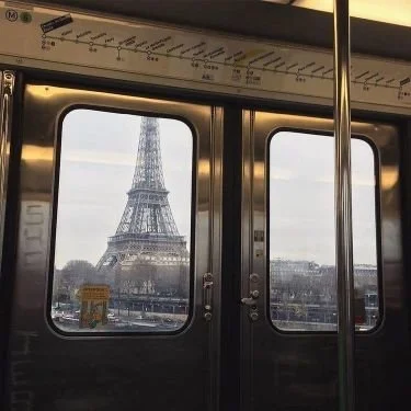 View of the Eiffel Tower through the subway train window.