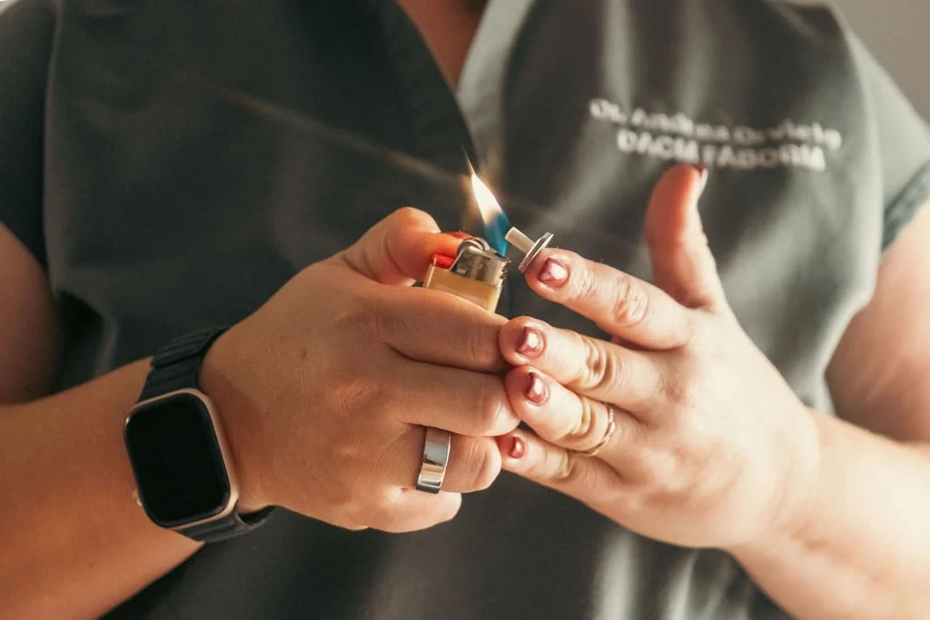 Dr. Andrea Orvieto briefly using flame to create suction for cupping treatment