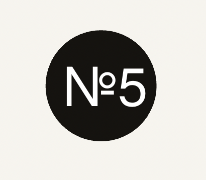 A black circle with white text inside that reads 'N°5' on a white background.