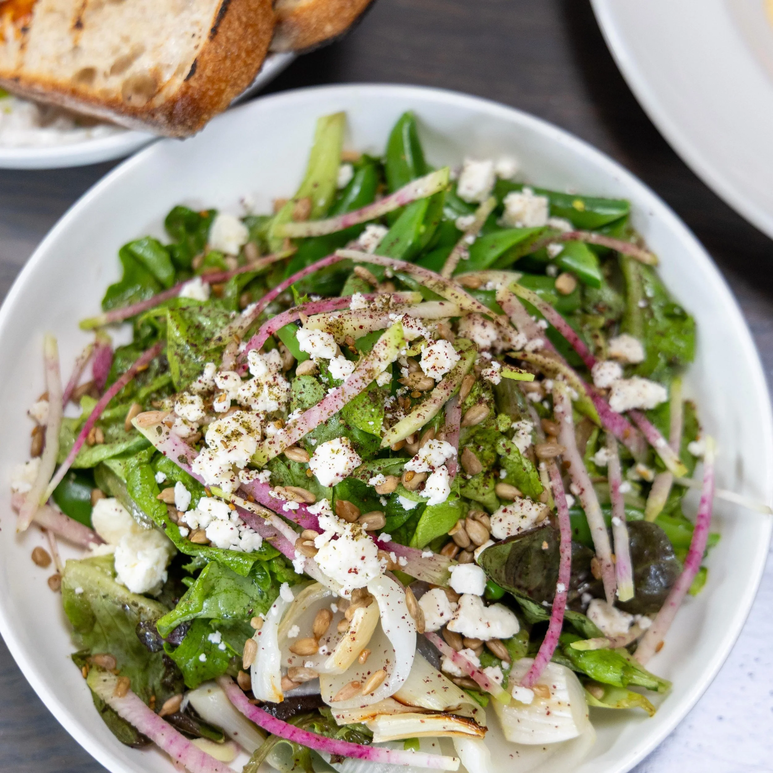 The Spring Salad 🌿

Tucker Farm greens with roasted Vidalia onions, sugar snap peas, watermelon radish, goat cheese, and sunflower seeds.

That simple. That good.