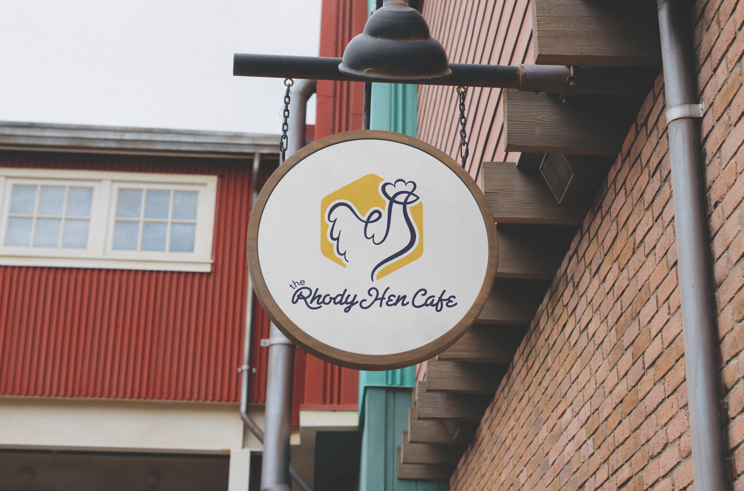 Image of Cafe sign with Chicken logo and text reading "The Rhody Hen Cafe"