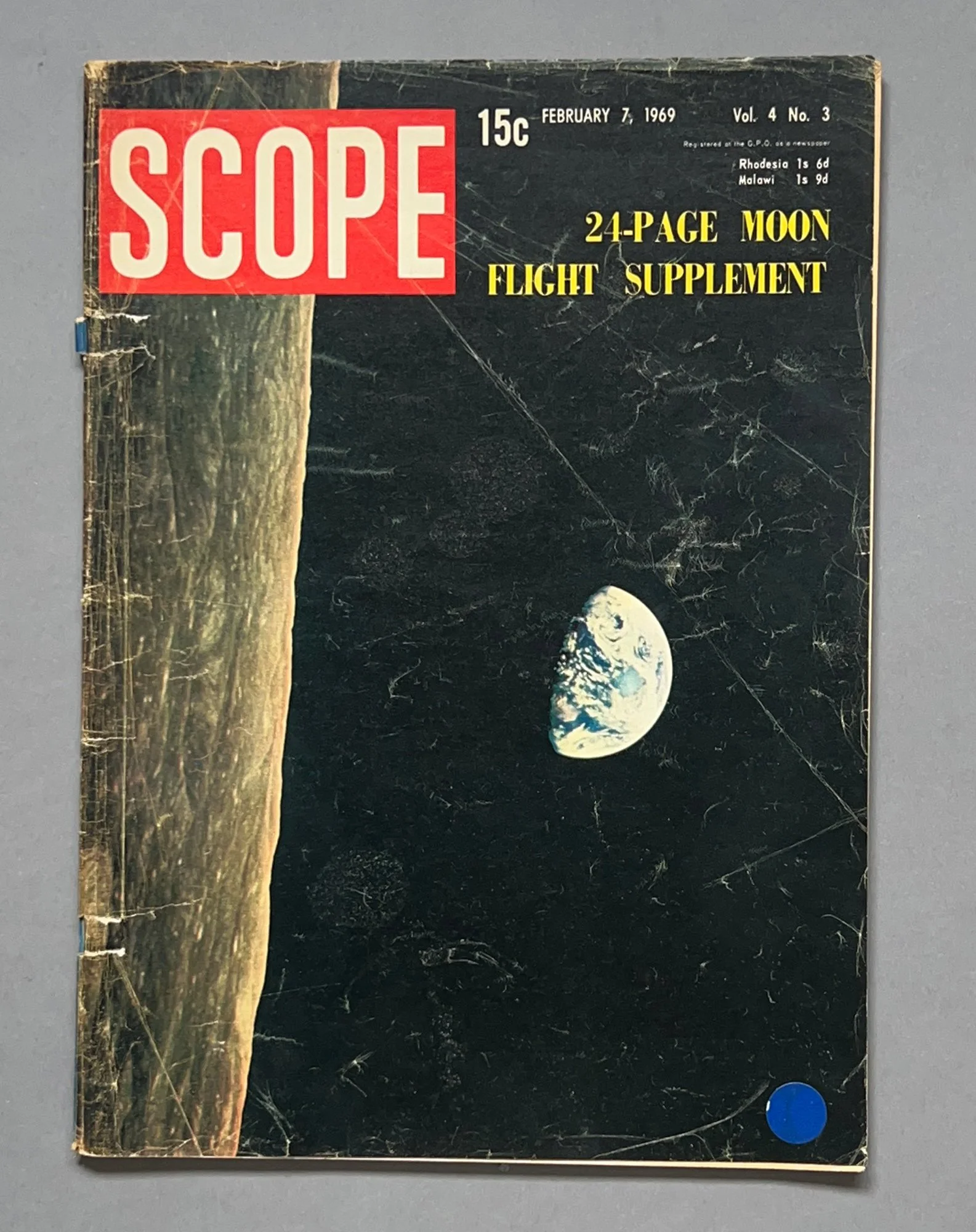 A vintage magazine cover of "Scope" dated February 7, 1969, featuring an image of Earth seen from space and the Moon, with a headline about a 24-page moon flight supplement.