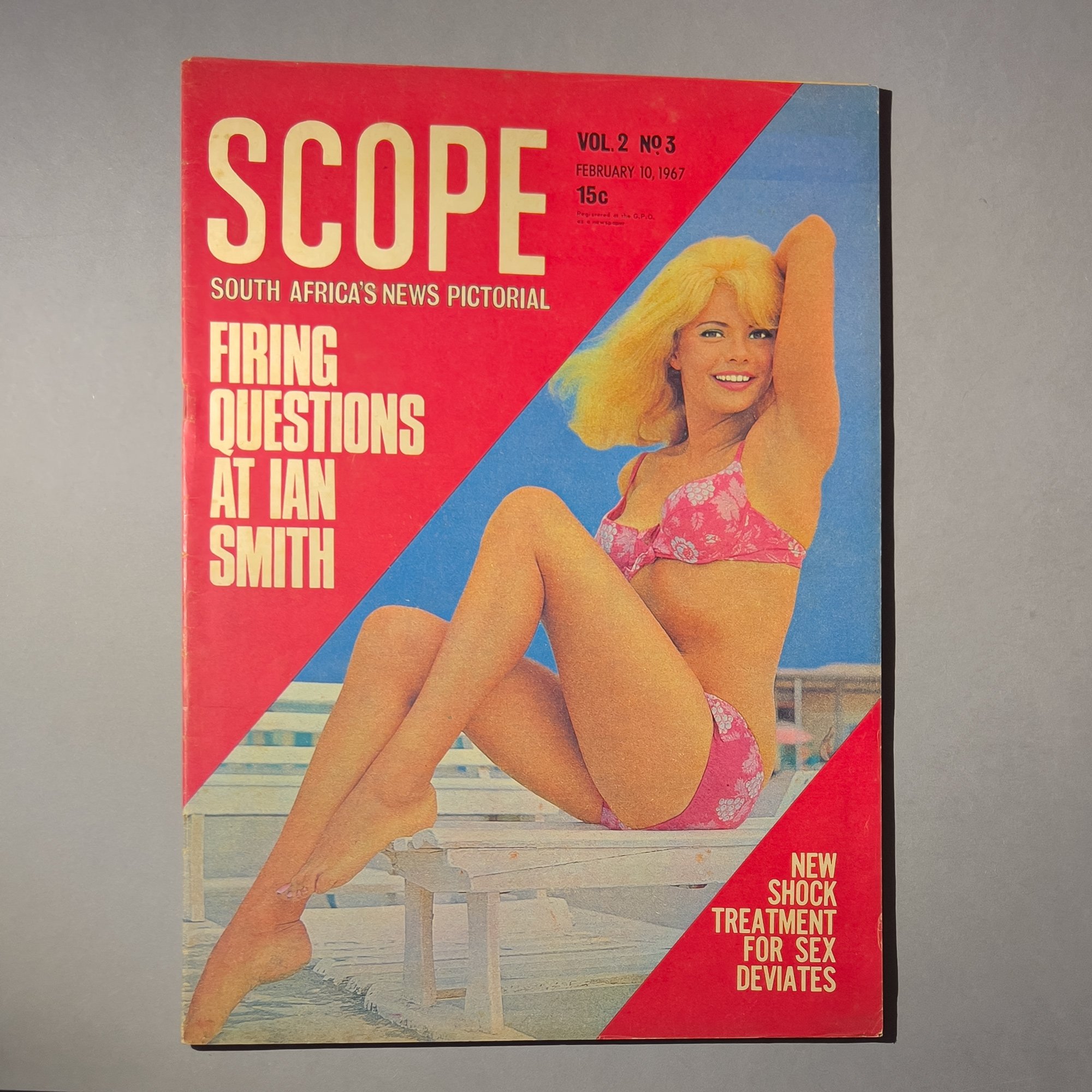 A 1967 magazine titled 'Scope' with a cover photo of a woman in a pink bikini sitting outdoors on a wooden bench, with a building and blue sky in the background. The magazine features headline text about firing questions at Ian Smith and a new shock 