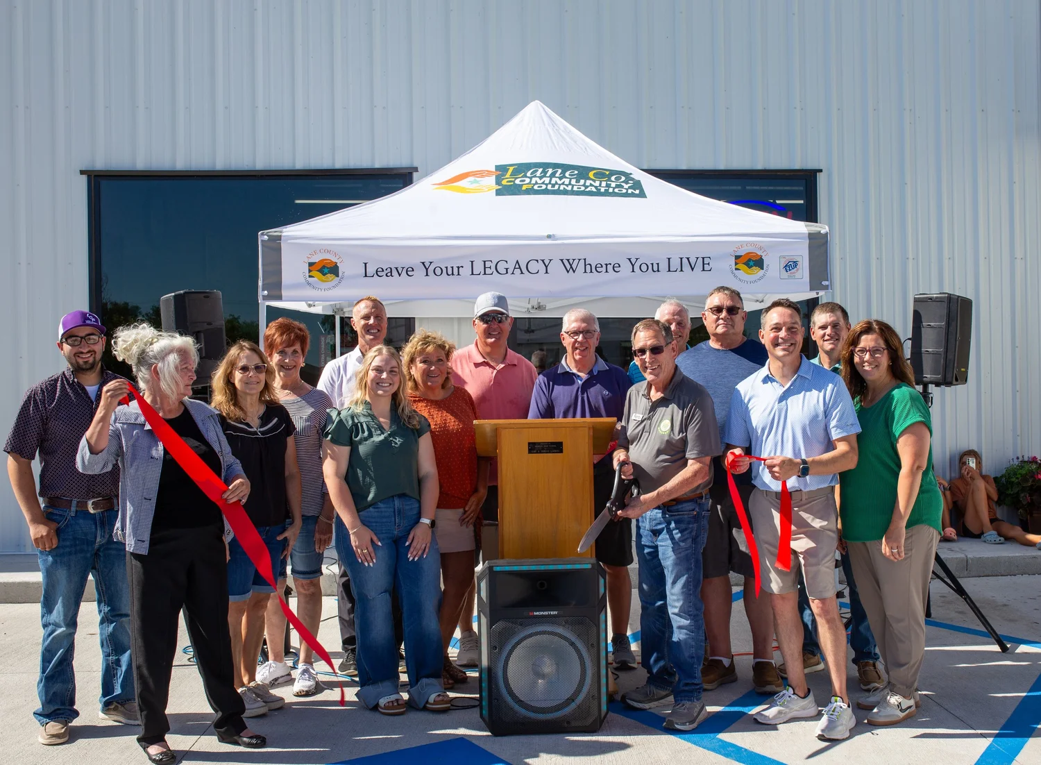 Community members at the Lane Co. Community Grocery ribbon-cutting ceremony