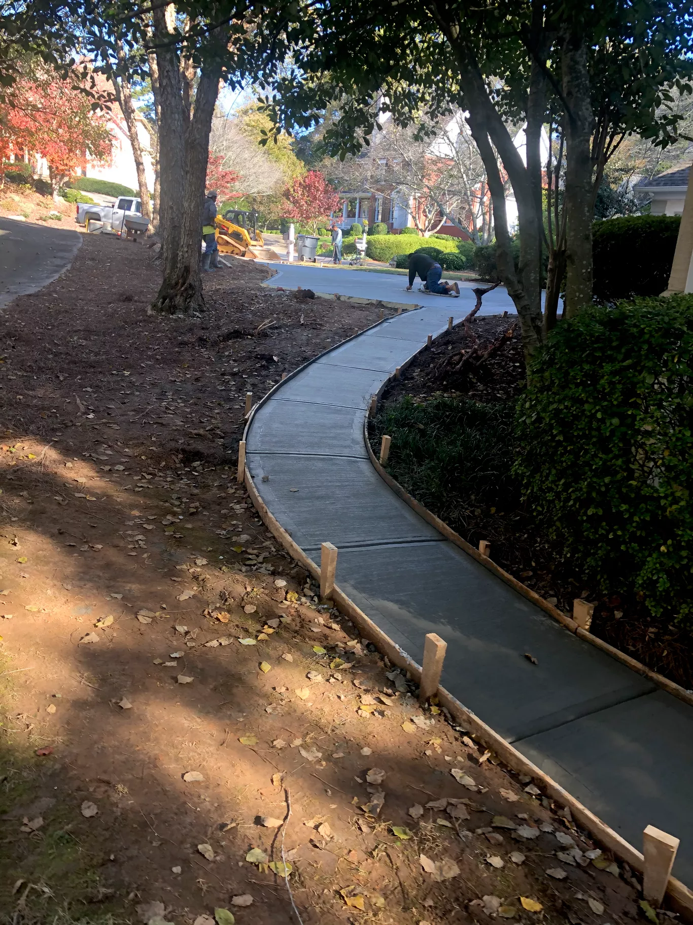 Precision work in tight access areas. We carefully hand-finish edges around fences and landscaping, ensuring a perfect fit and clean lines even in challenging spaces