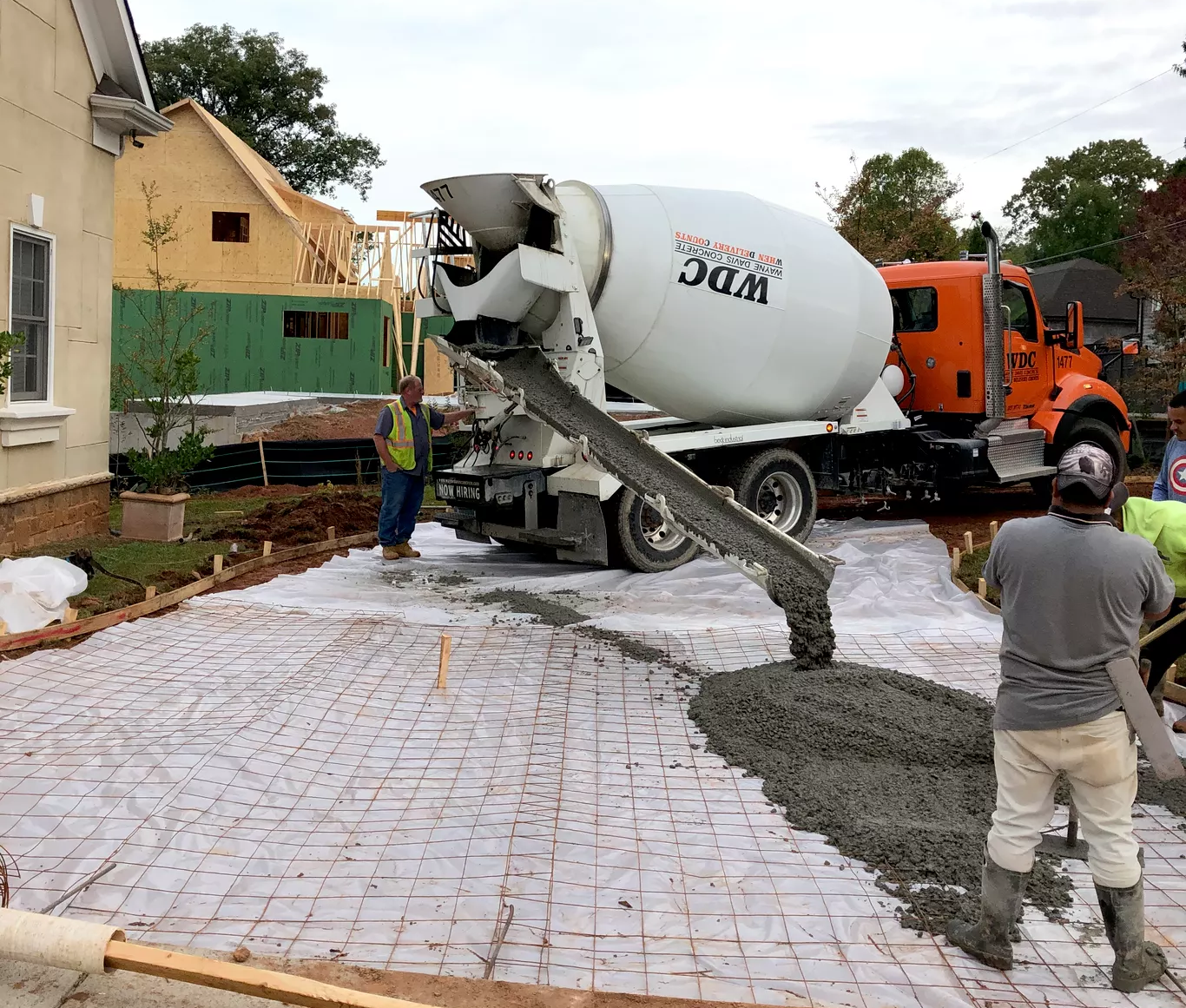 Large-scale residential pour in action. We coordinate seamlessly with concrete suppliers to ensure efficient, high-quality installation for projects of any size.