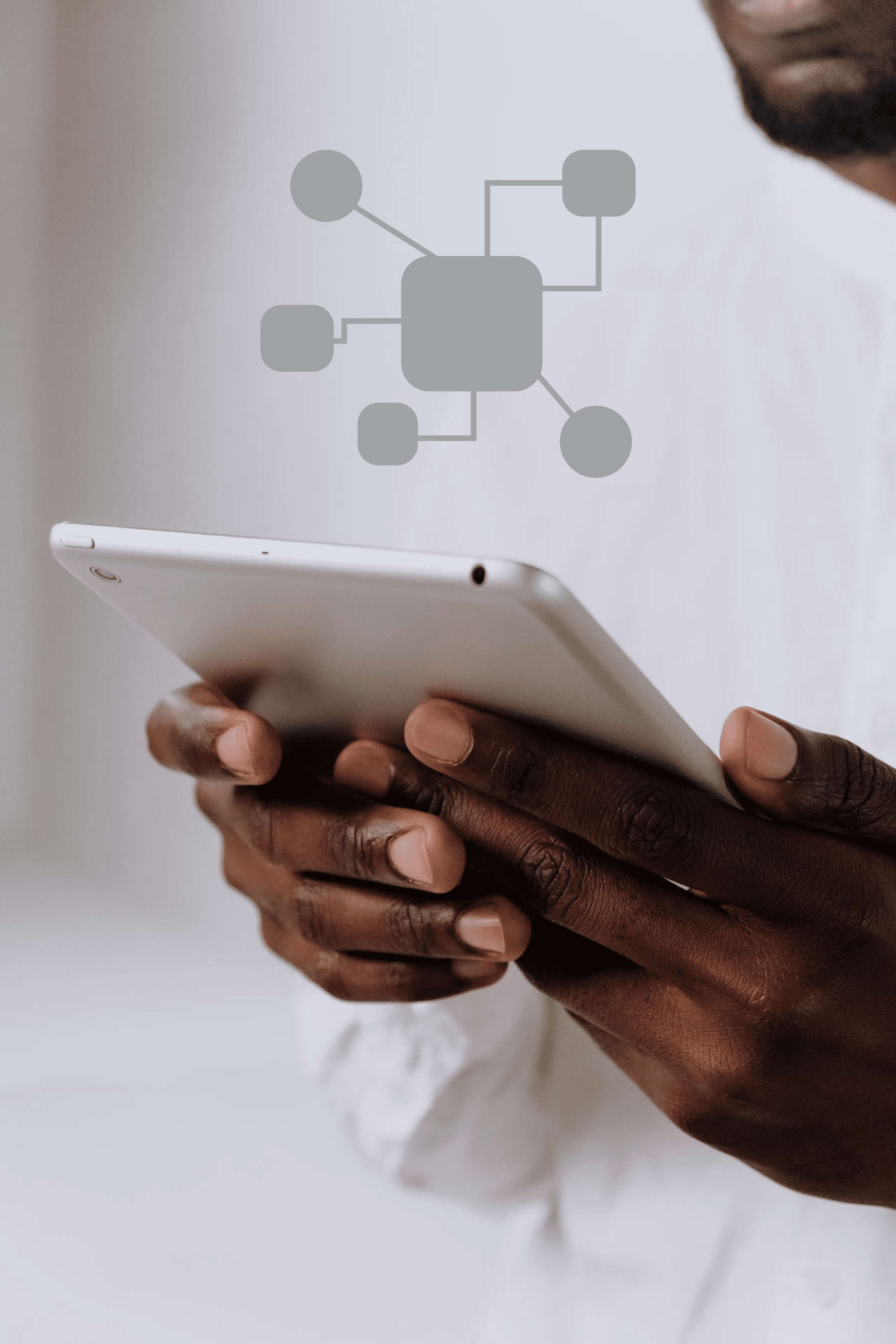 Person holding a white tablet device with a graphic of a network diagram overlayed.