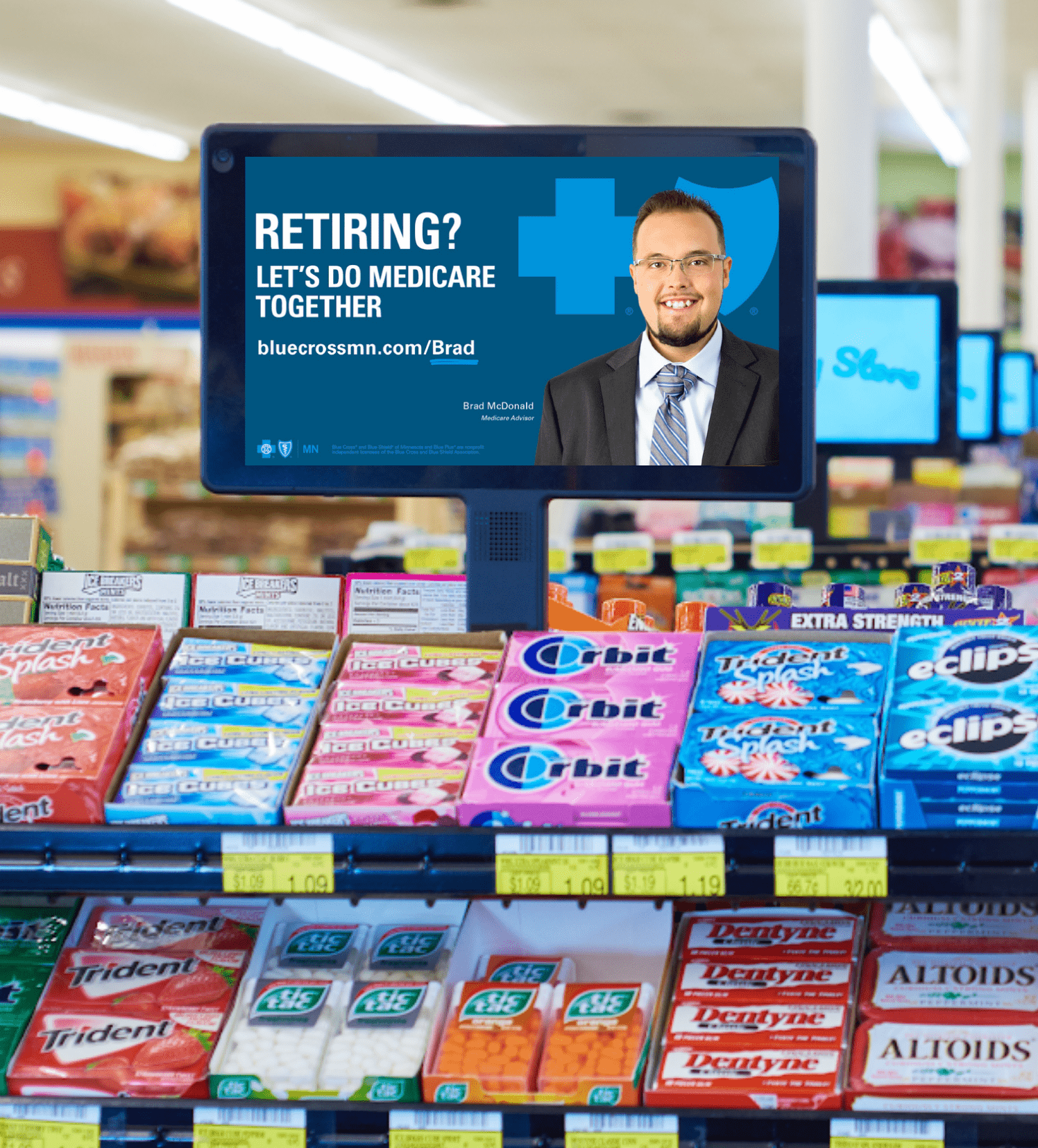 Mediaworks Checkout TV advertising display in a grocery store aisle.