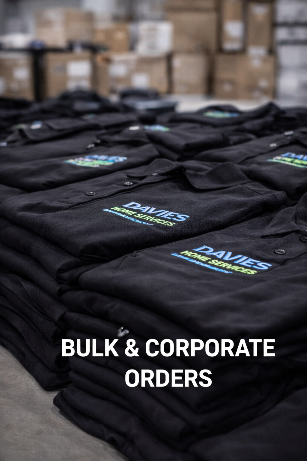Rows of black polo shirts with a logo that reads 'DAVIES HOME SERVICES' on a table, with boxes in the background. Text over the image says 'Bulk & Corporate Orders'.