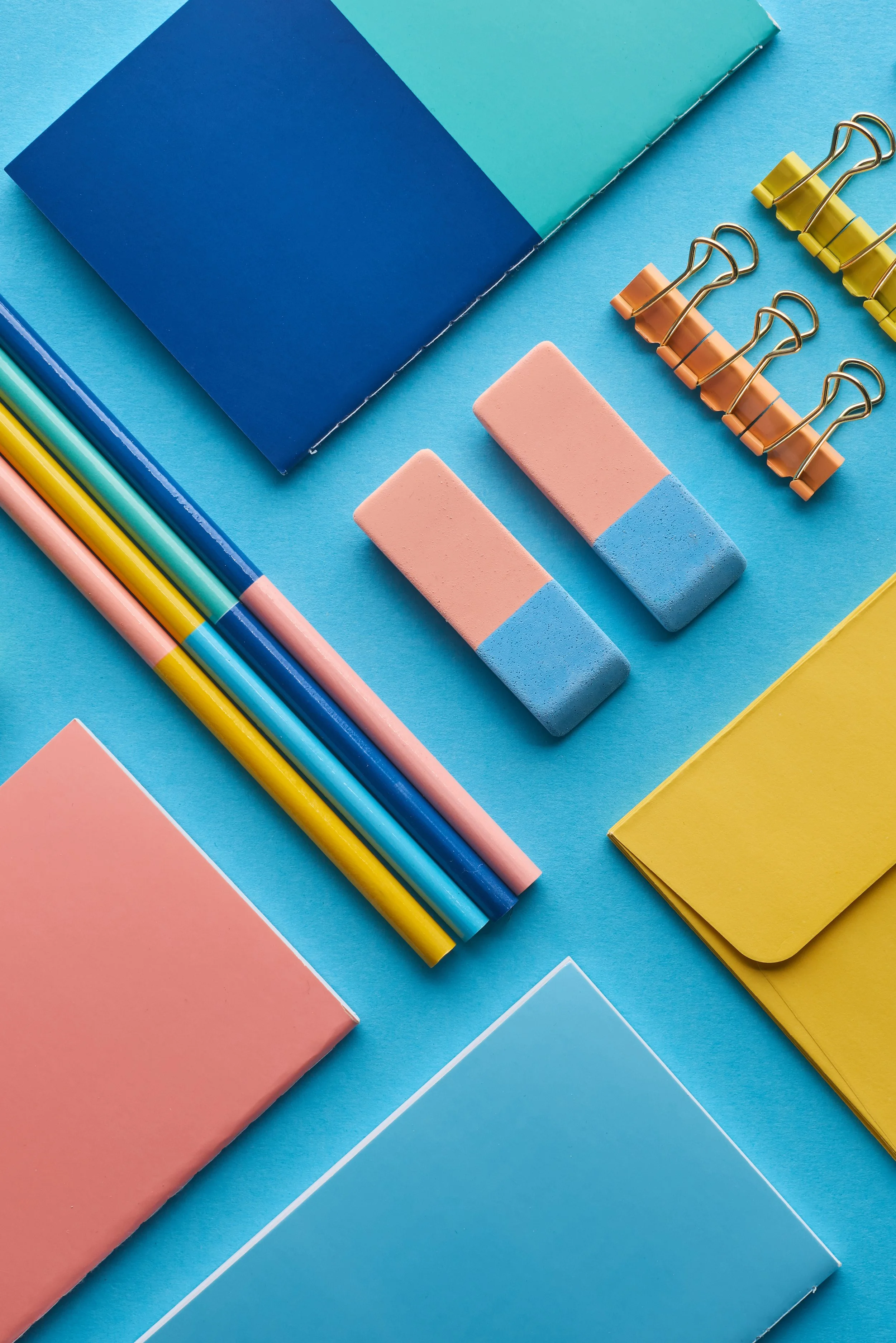 Colorful office stationary laid out in an angled grid pattern