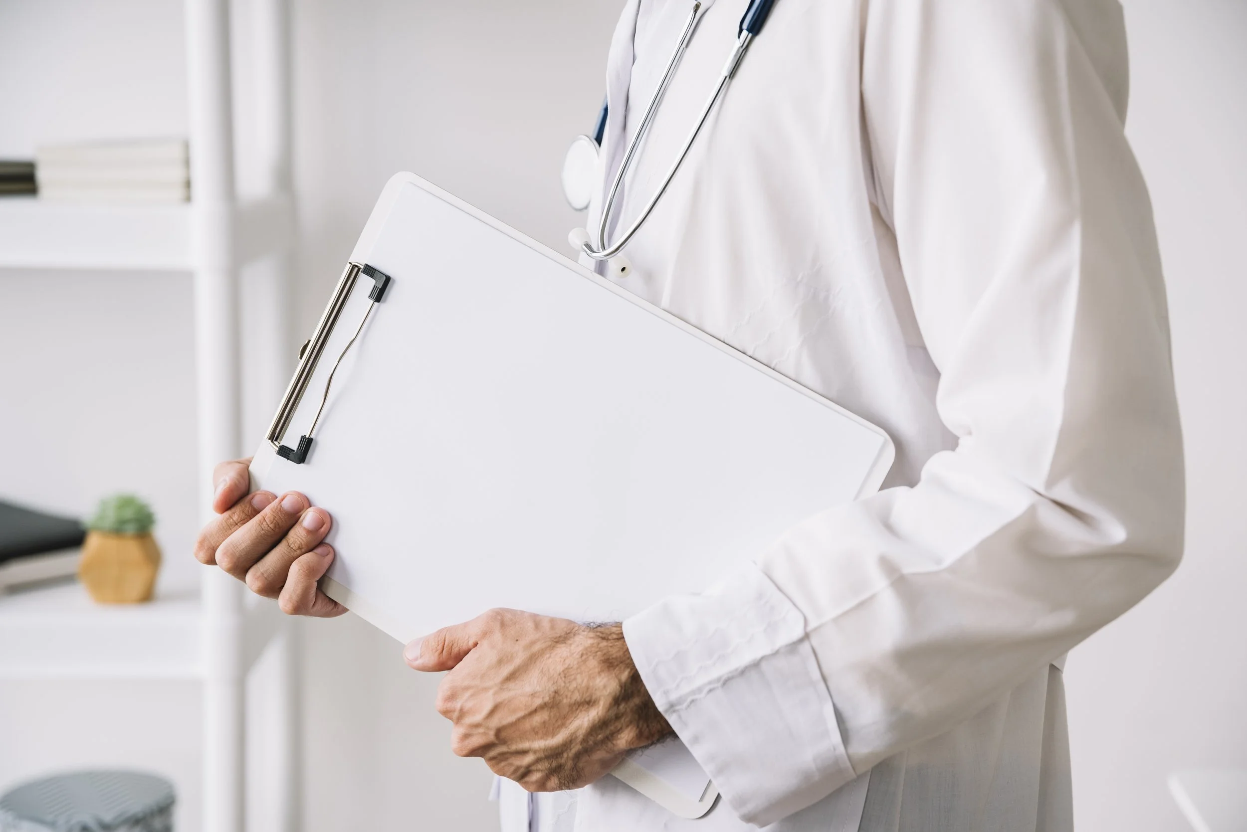 midsection-view-doctor-hand-holding-clipboard-with-blank-white-paper.jpg