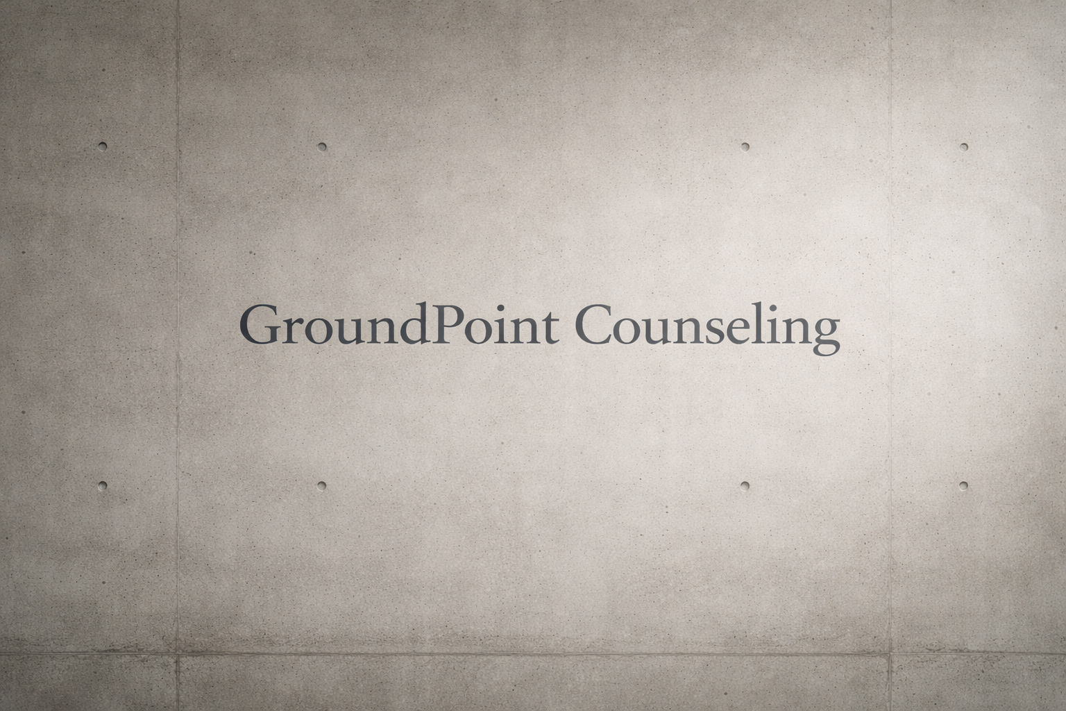 GroundPoint Counseling sign on a concrete wall.