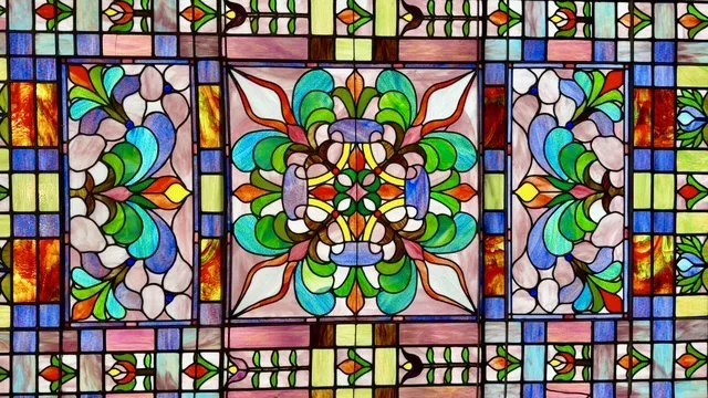 Colorful stained glass window with floral and geometric patterns in our historic downtown Breckenridge, CO building.