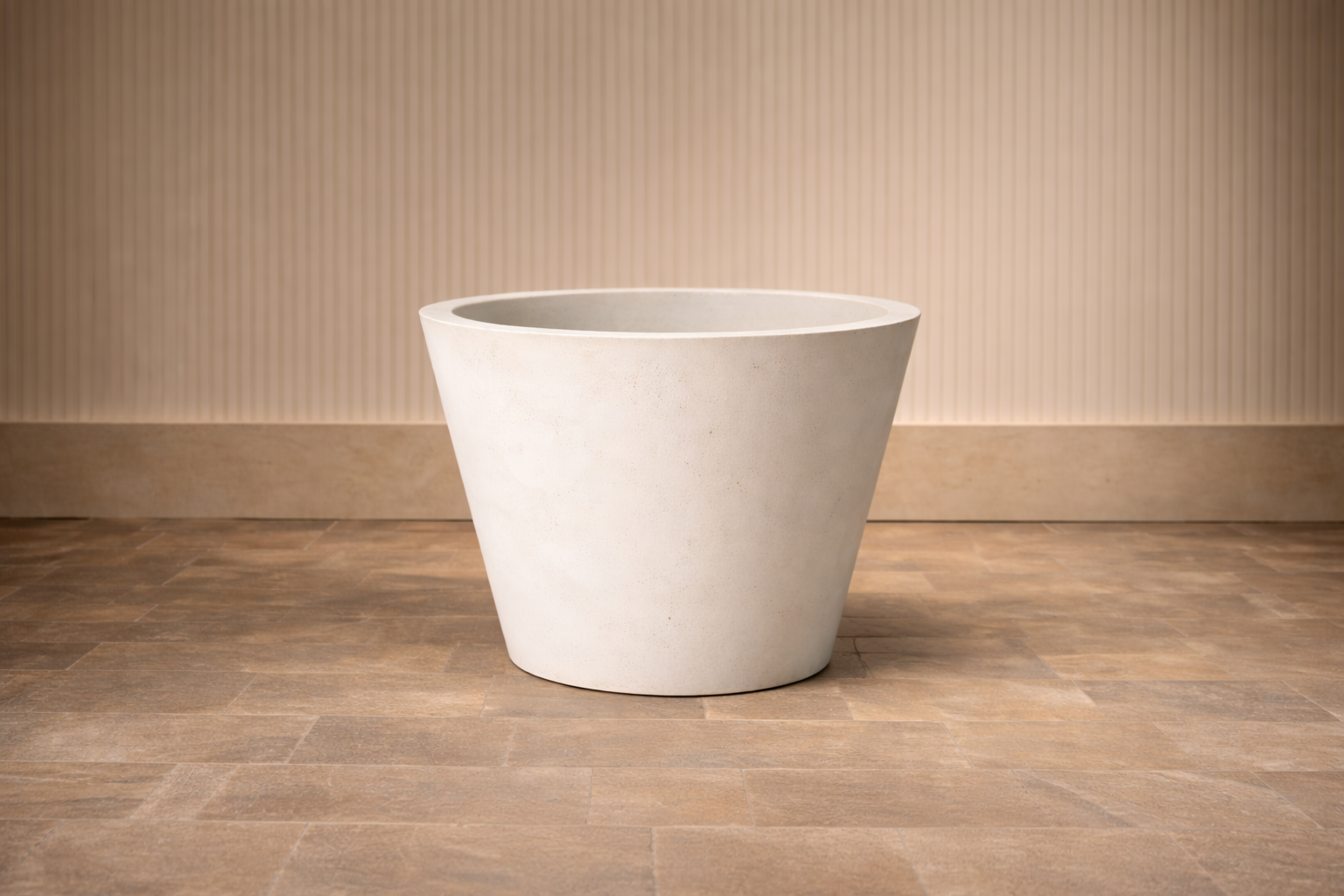 Empty white modern flower pot on light wooden floor with beige striped wall background.
