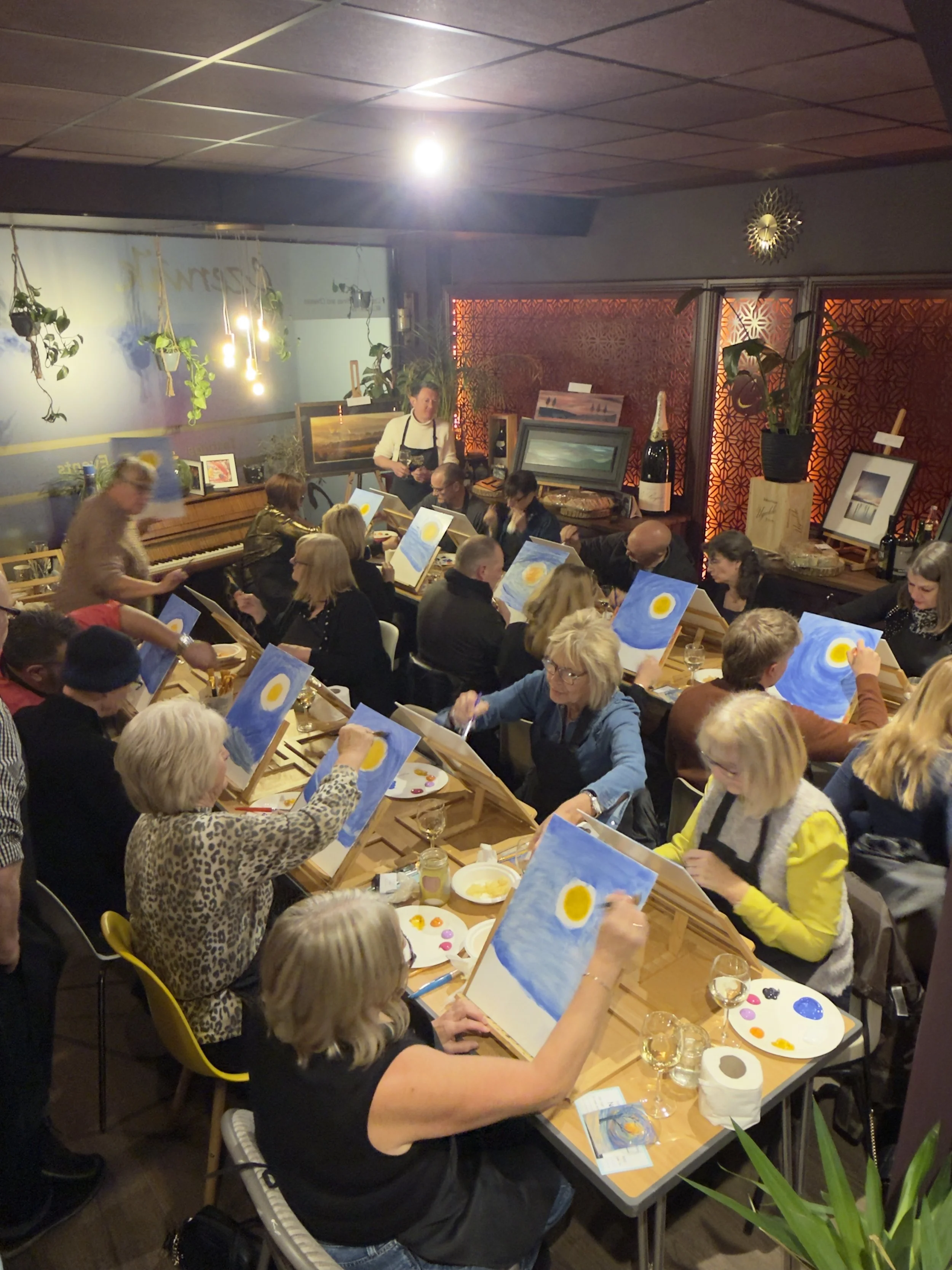 Guests taking part in a Canvas & Cava paint and sip night in Brighouse, with visitors travelling from Halifax, Huddersfield and Leeds to enjoy a guided painting experience. Hosted at Czerwik Fine Wines & Cheeses, guests follow step-by-step instructio