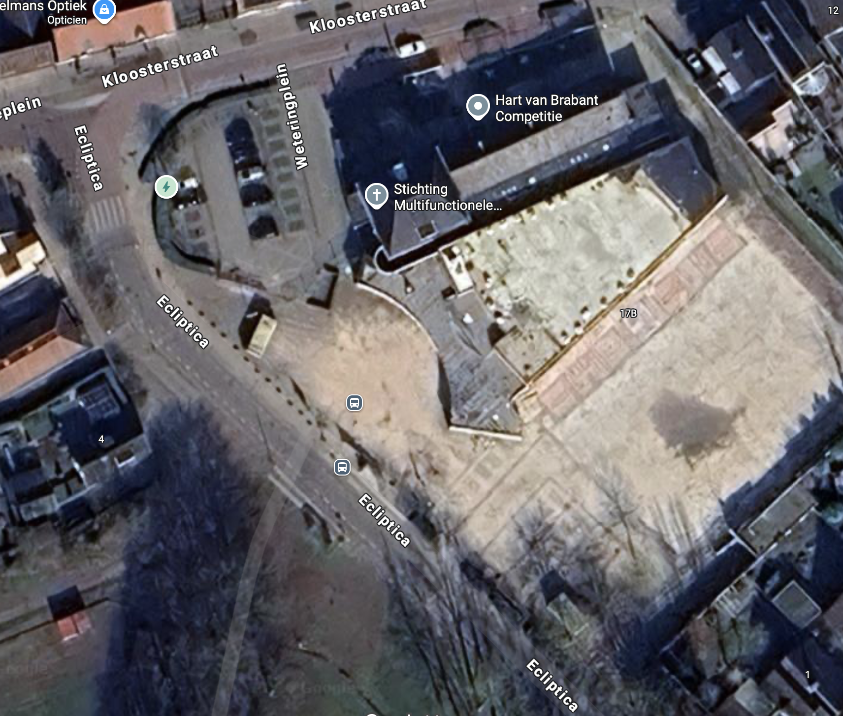 Satellite view of a construction site and nearby streets labeled Kloosterstraat, Ecliptica, and Weterringplein, with parked cars and surrounding buildings.